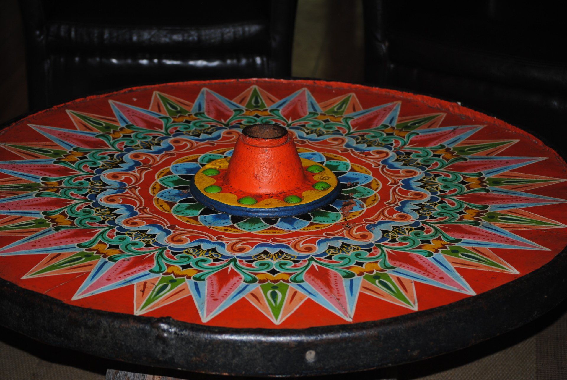 A round table with a colorful design on it