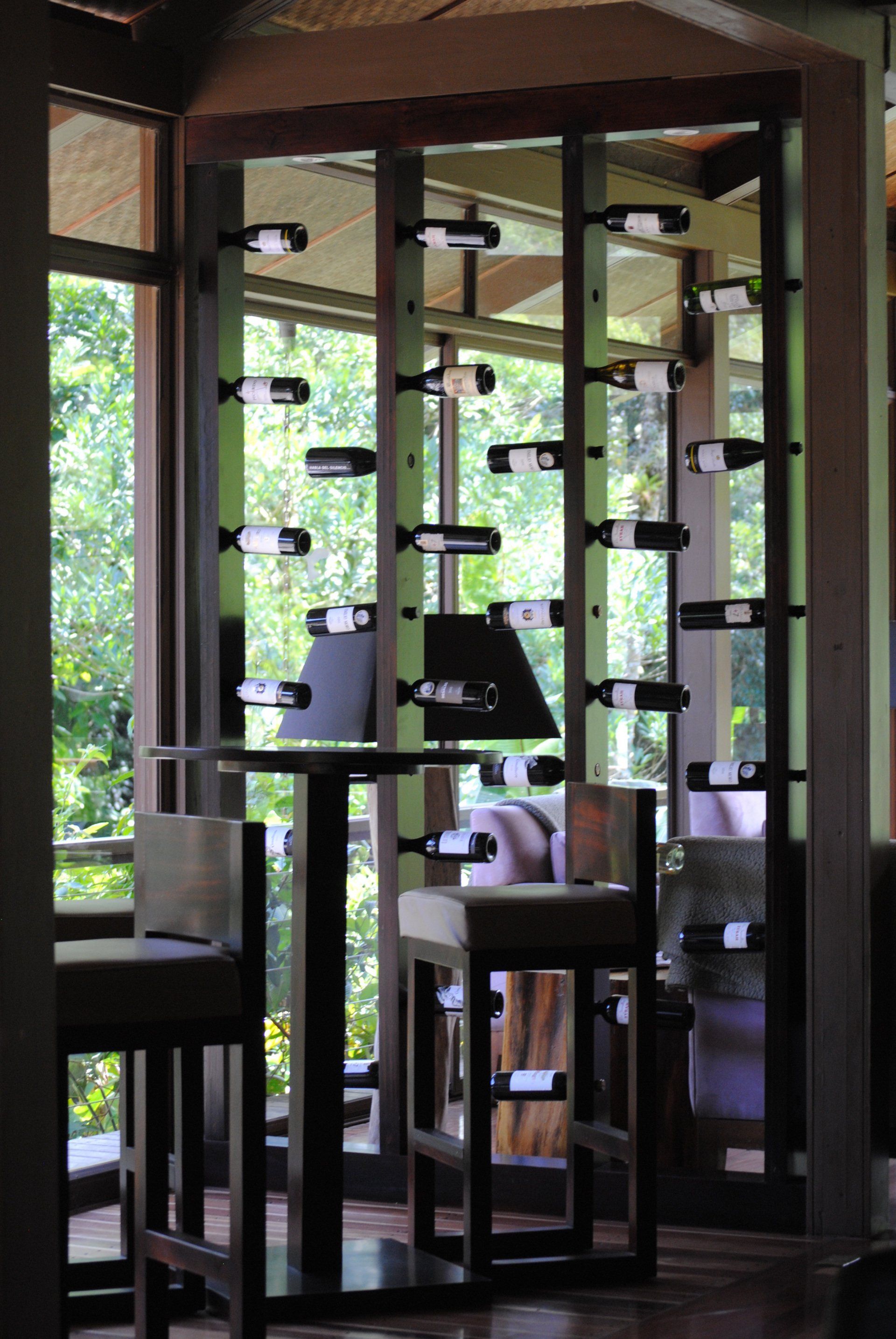 A room with lots of wine bottles on display