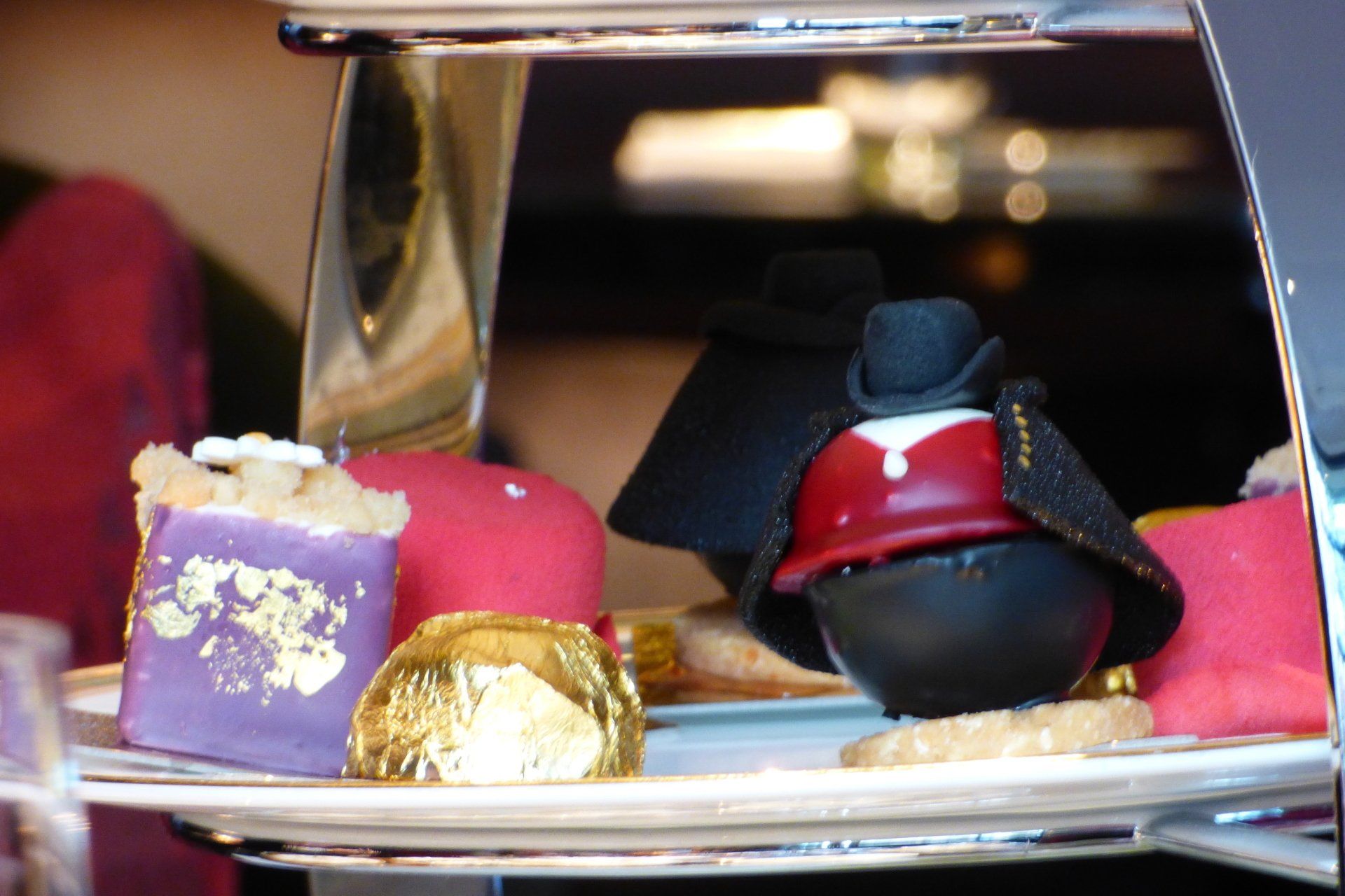 A tray of desserts with a vampire on top of it