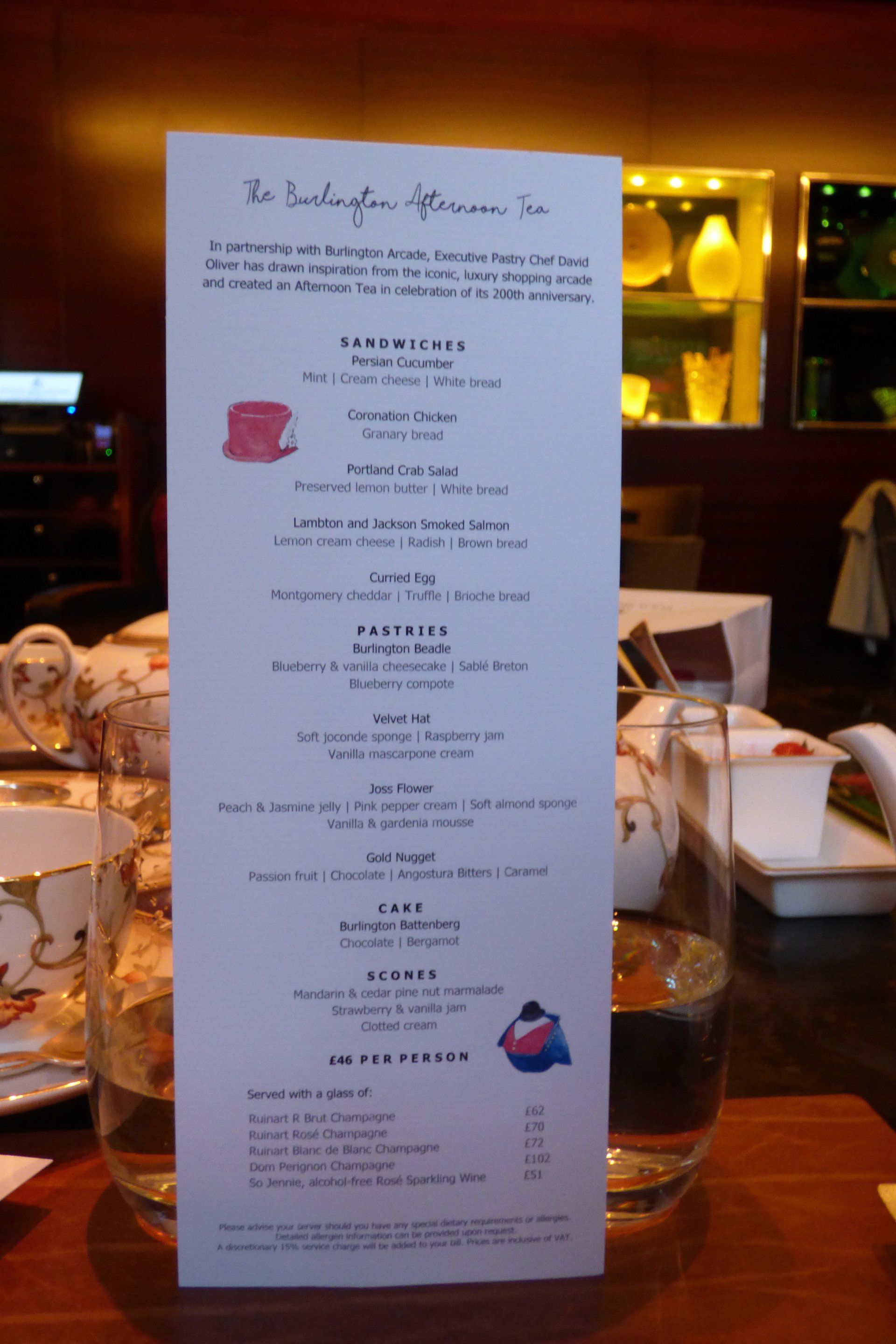A menu is displayed on a table in a restaurant