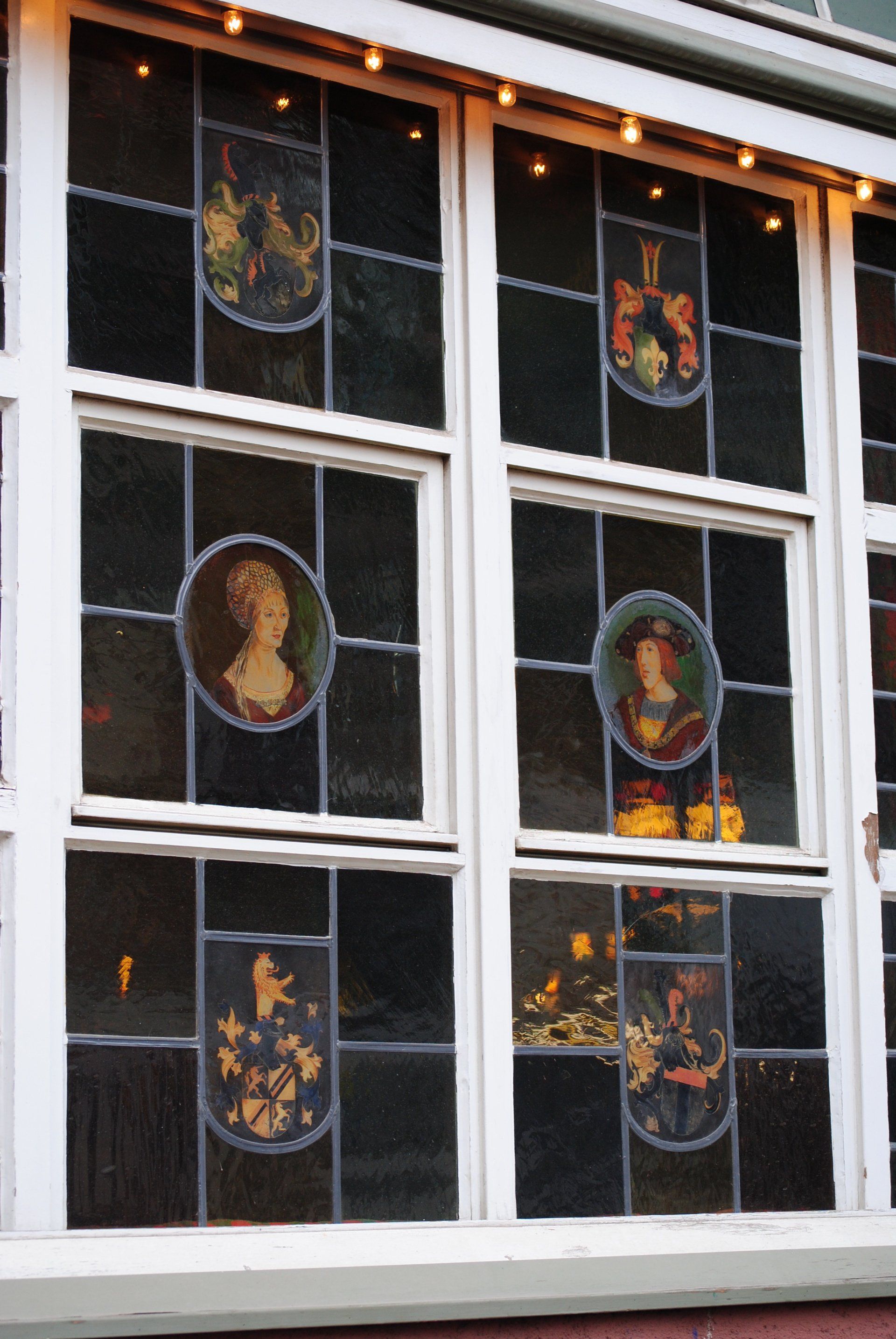 A stained glass window with a picture of a woman on it