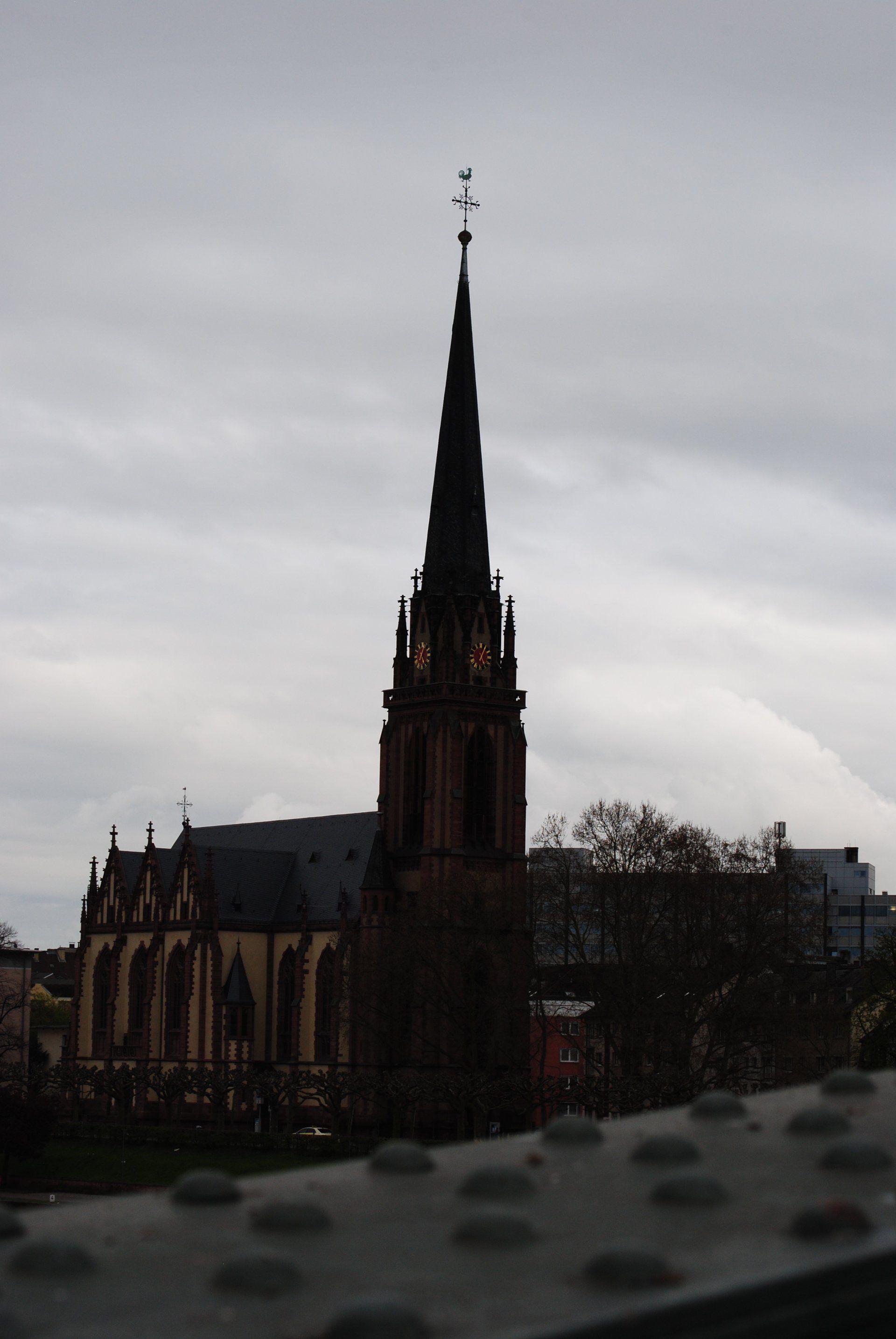 A church with a steeple and a cross on top