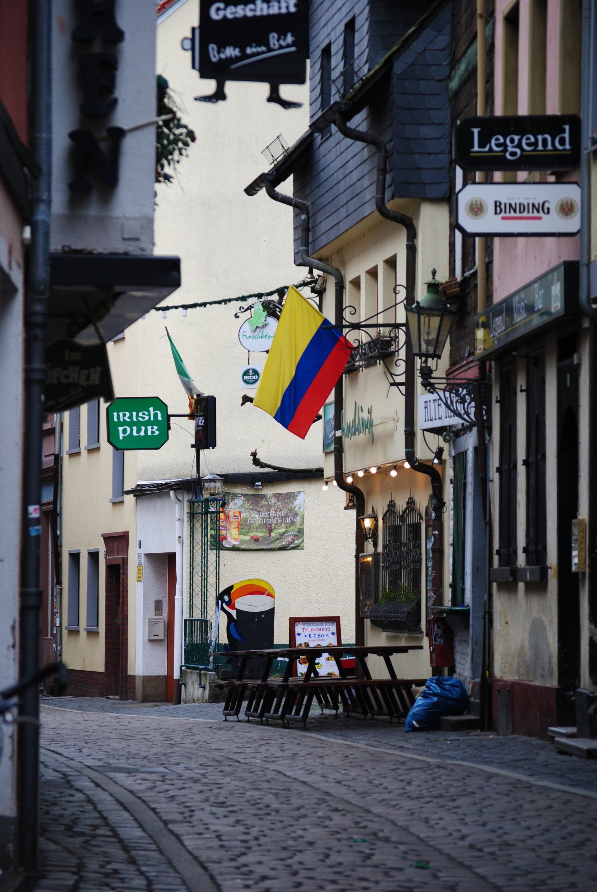 A narrow street with a sign that says legend on it