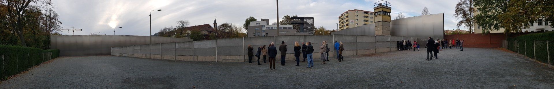 A blurry picture of a group of people walking down a street.