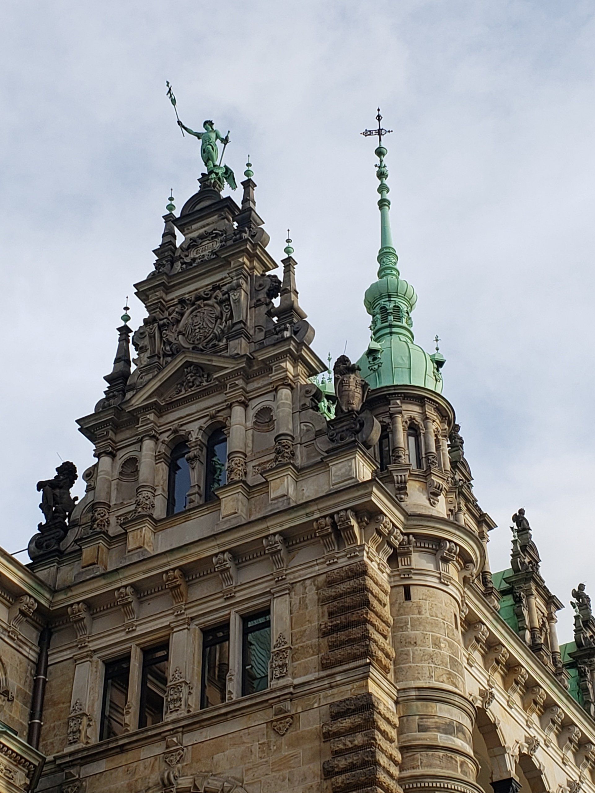 A large building with a statue on top of it
