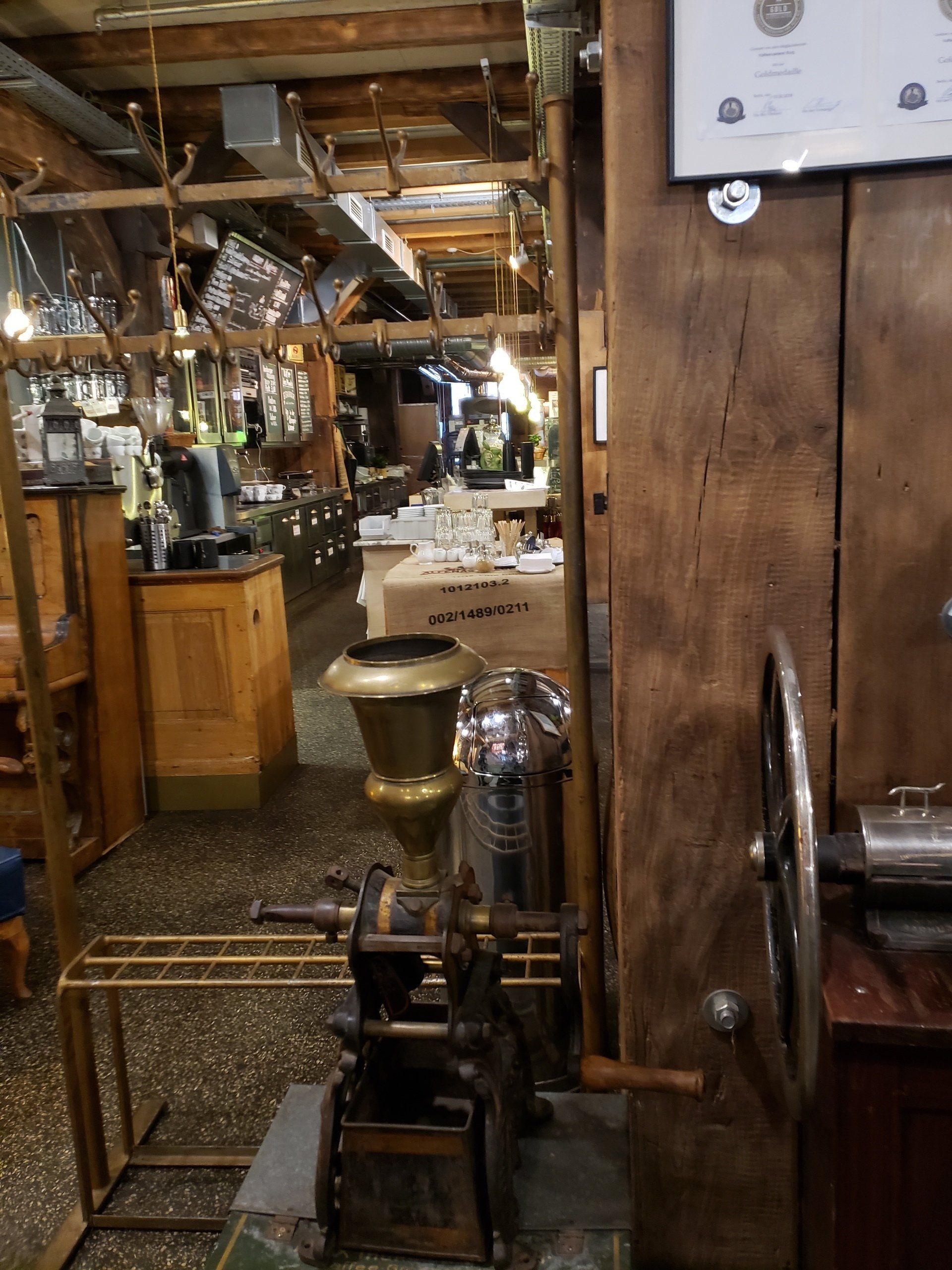 A coffee grinder is sitting in the middle of a restaurant