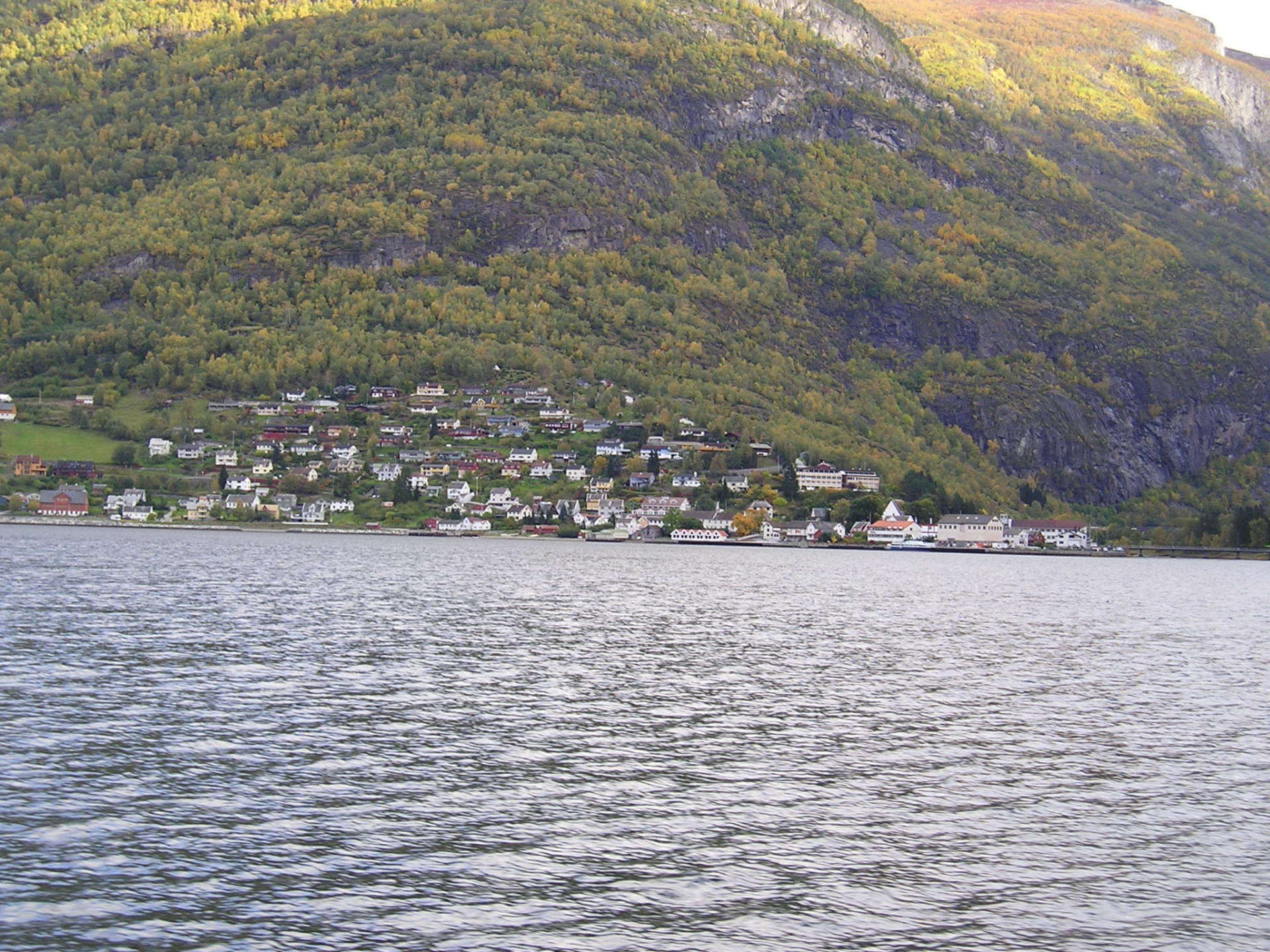 A large body of water with mountains in the background