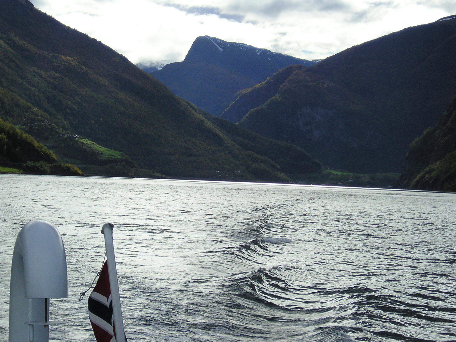 A large body of water with mountains in the background