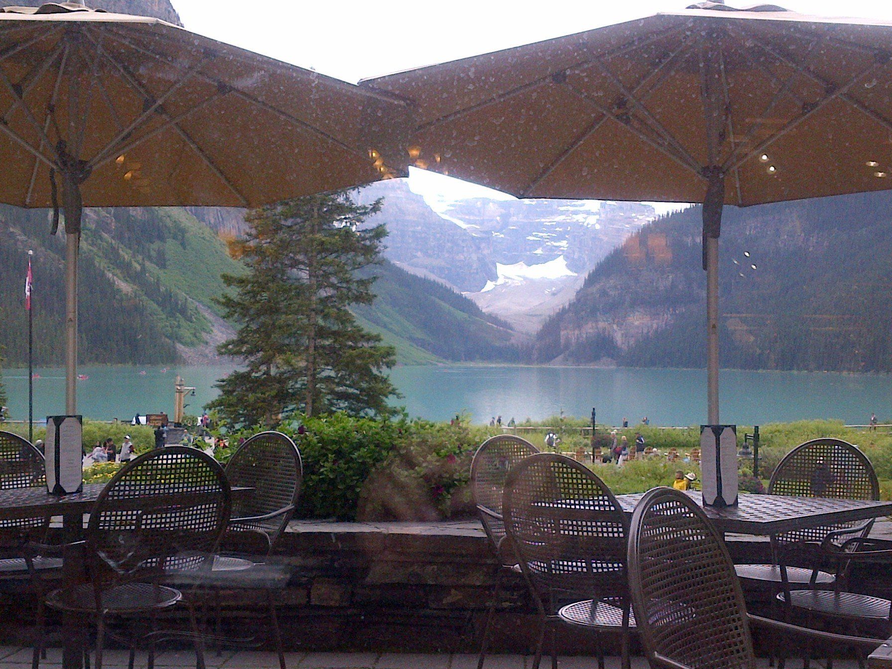 A view of a lake with mountains in the background