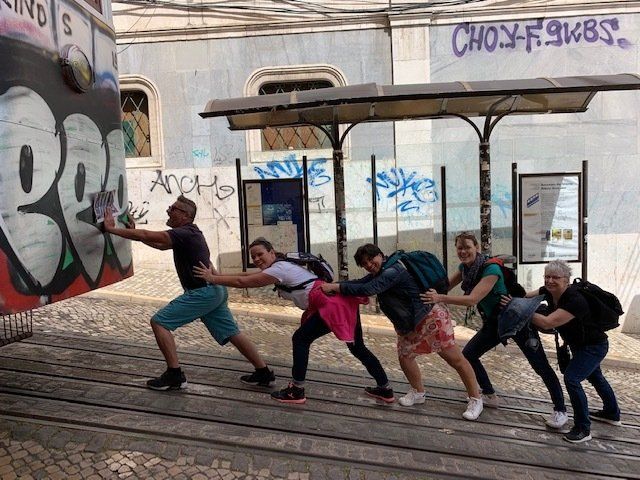 People pushing a cart