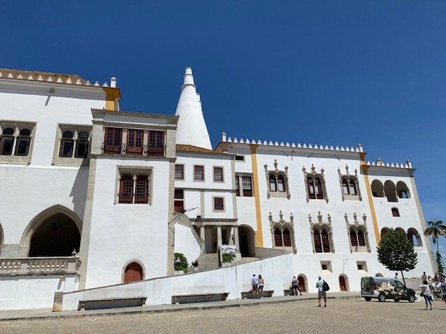 A large white building with a tower on top of it