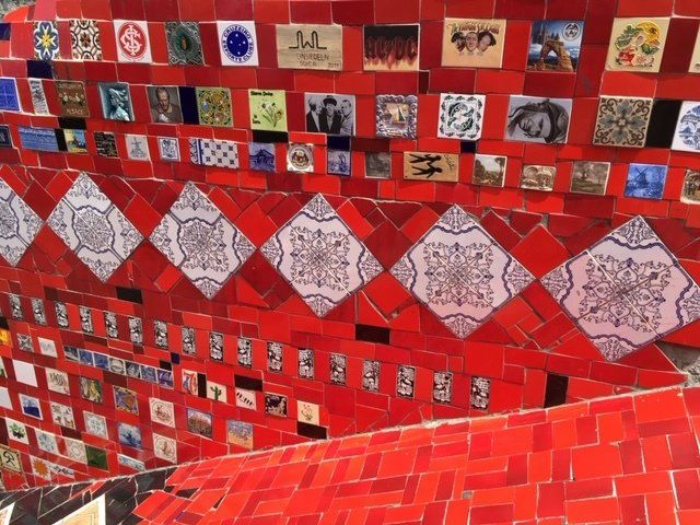 A red wall with a lot of tiles on it