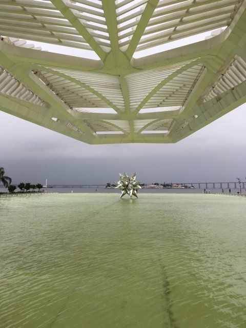 A view of a body of water from underneath a building