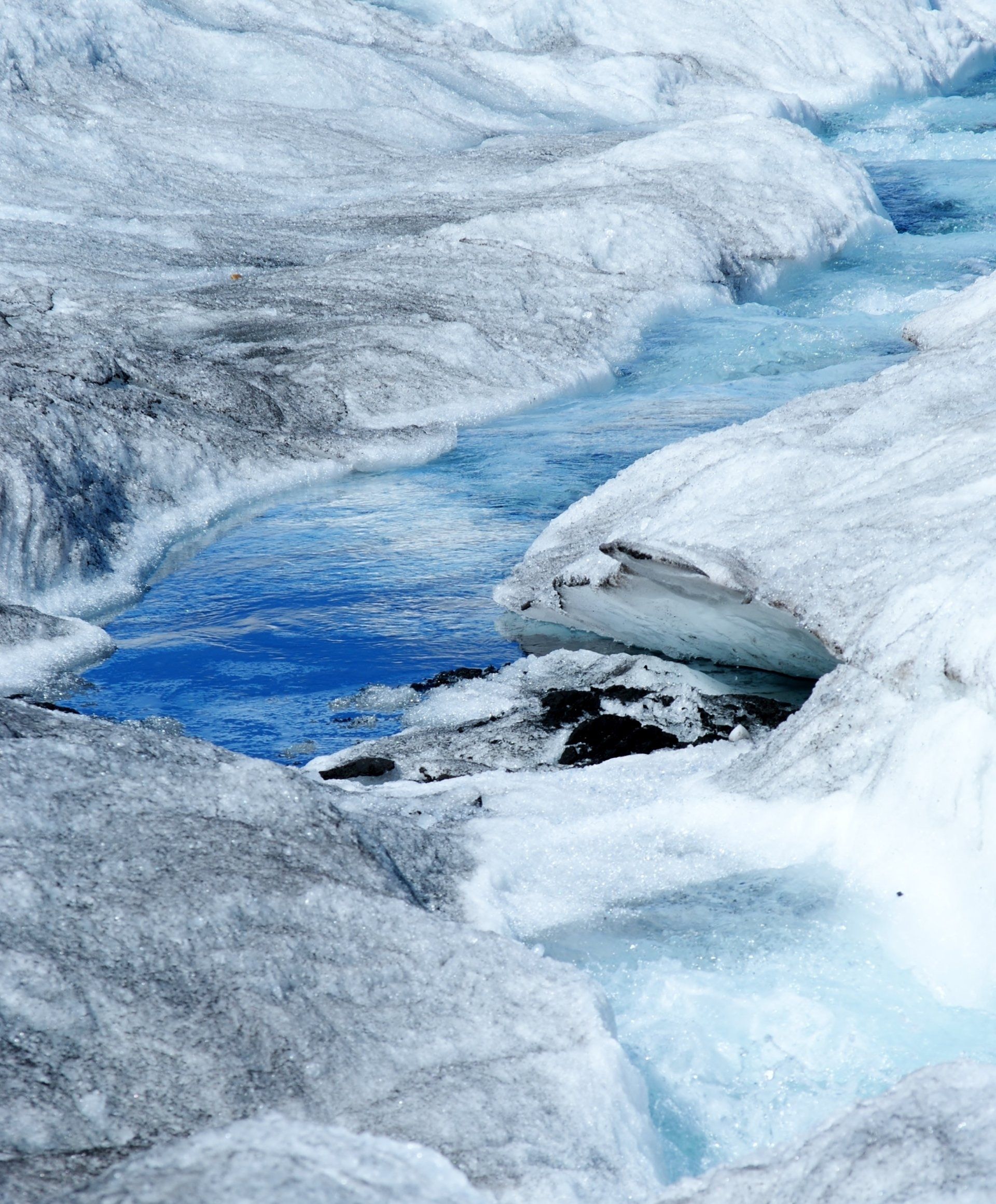 A close up of a river flowing through a glacier.