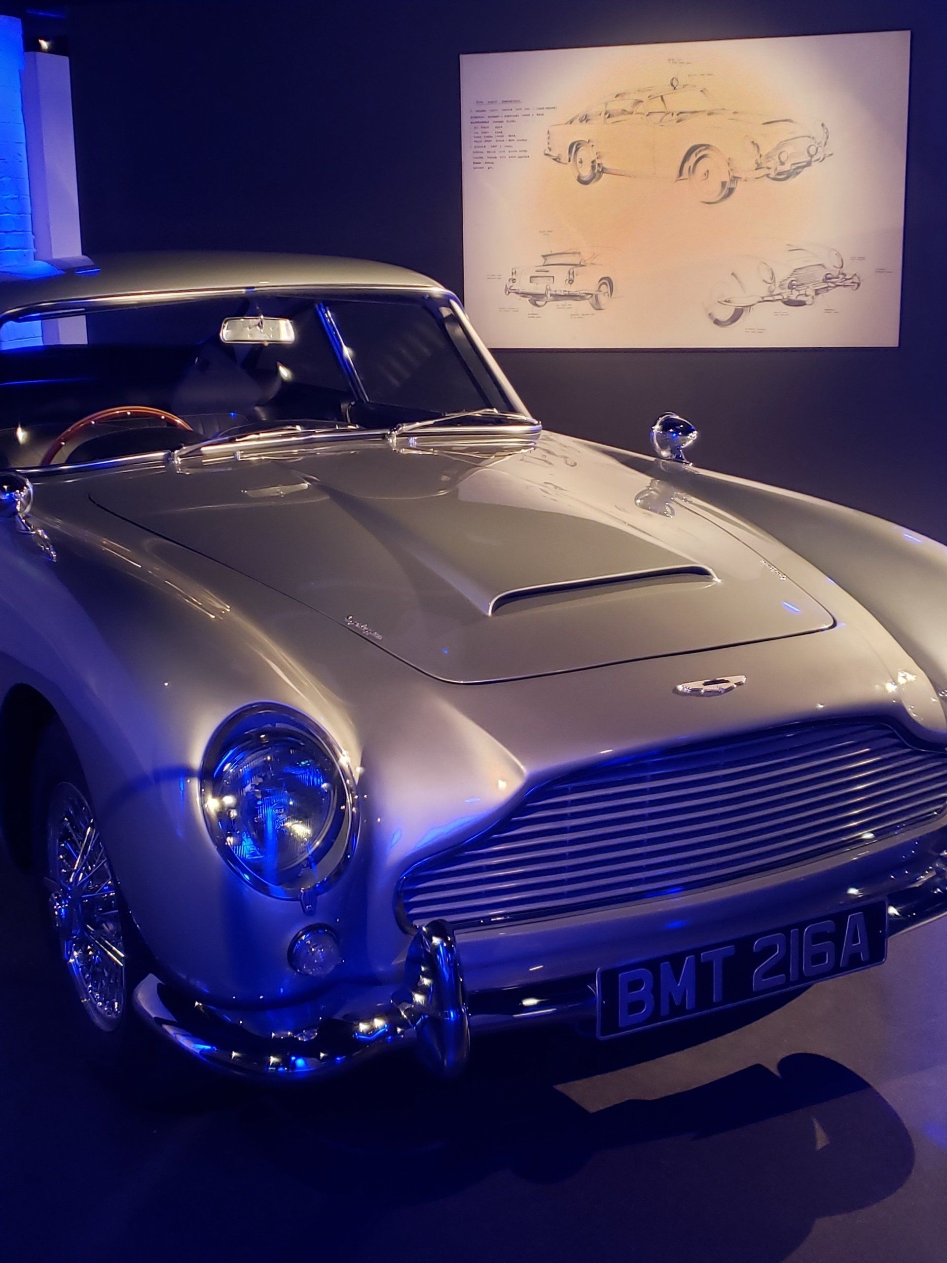 A silver car with a license plate that says ibmt 2153