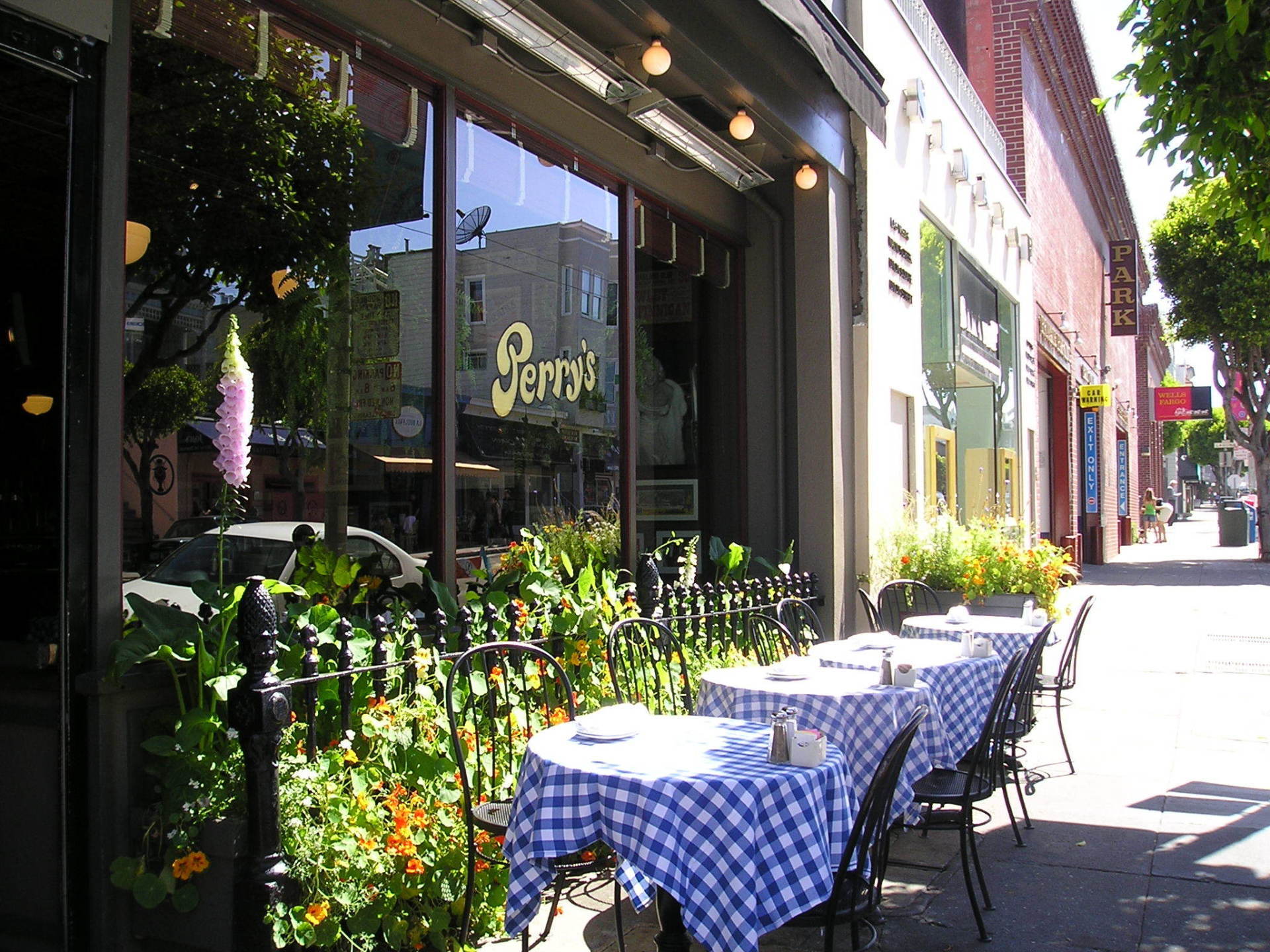 A restaurant called perry 's has tables outside