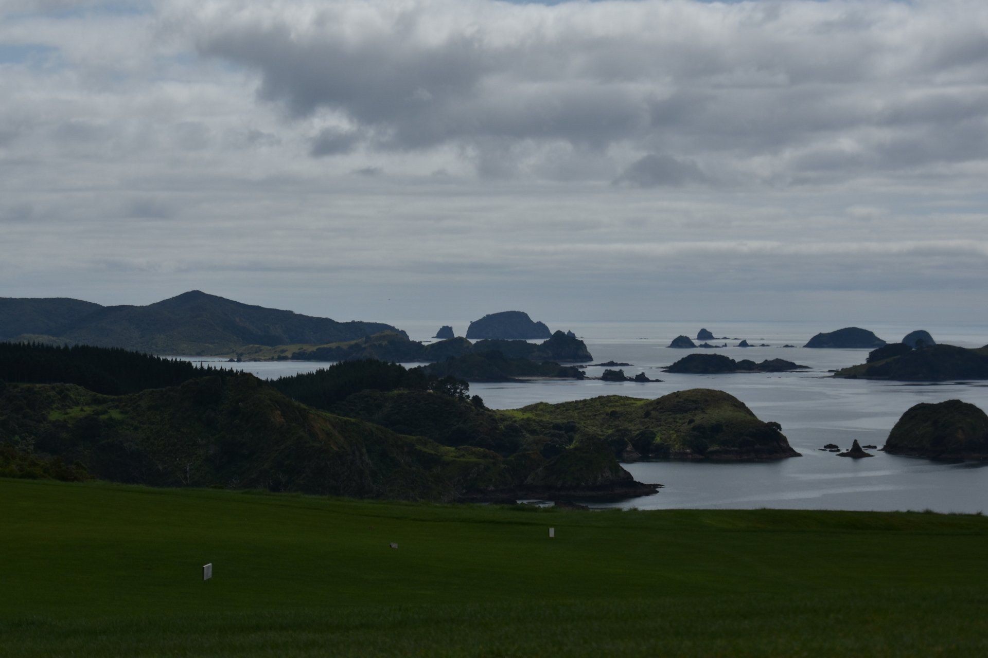 A view of a body of water with mountains in the background