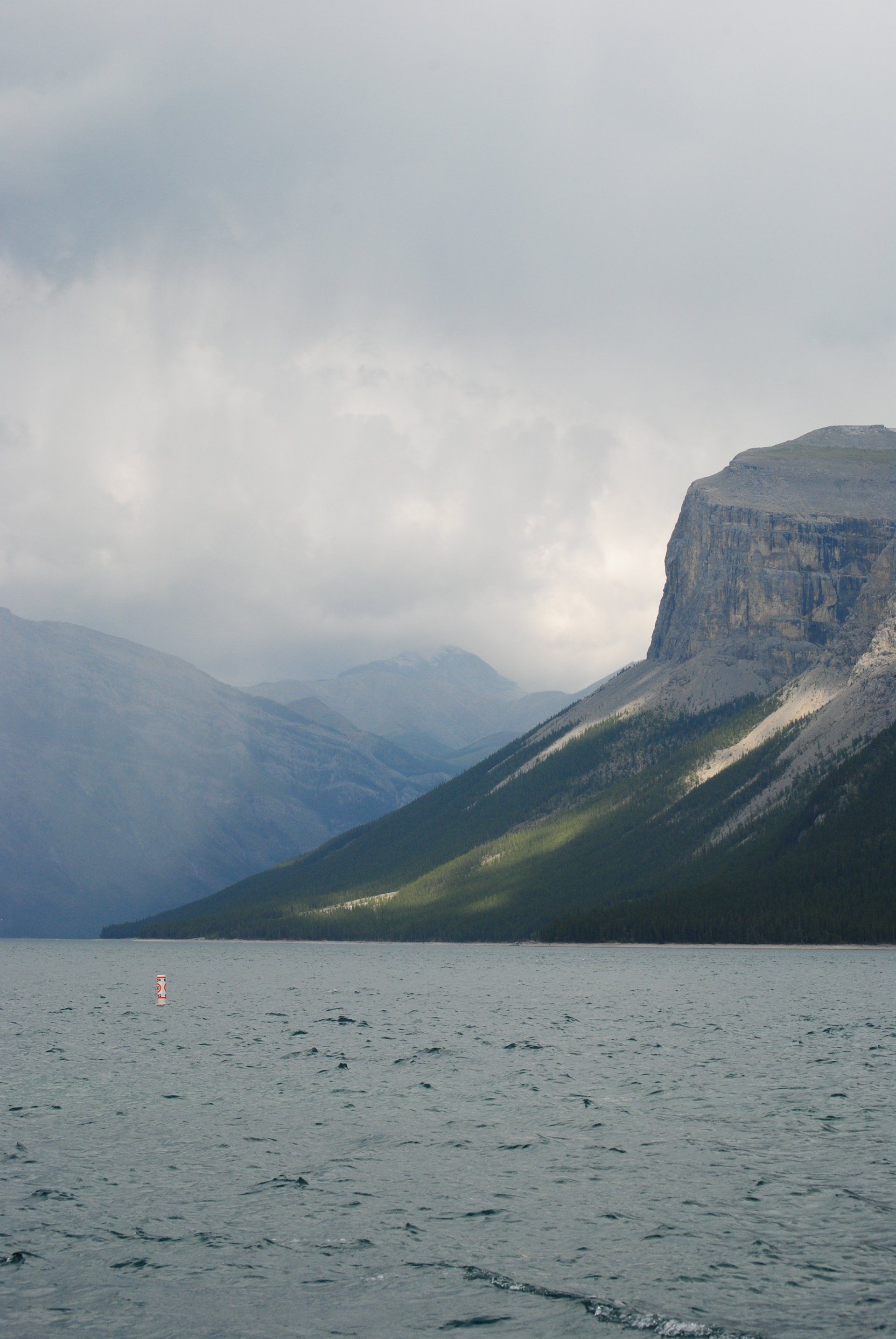 A large body of water with mountains in the background