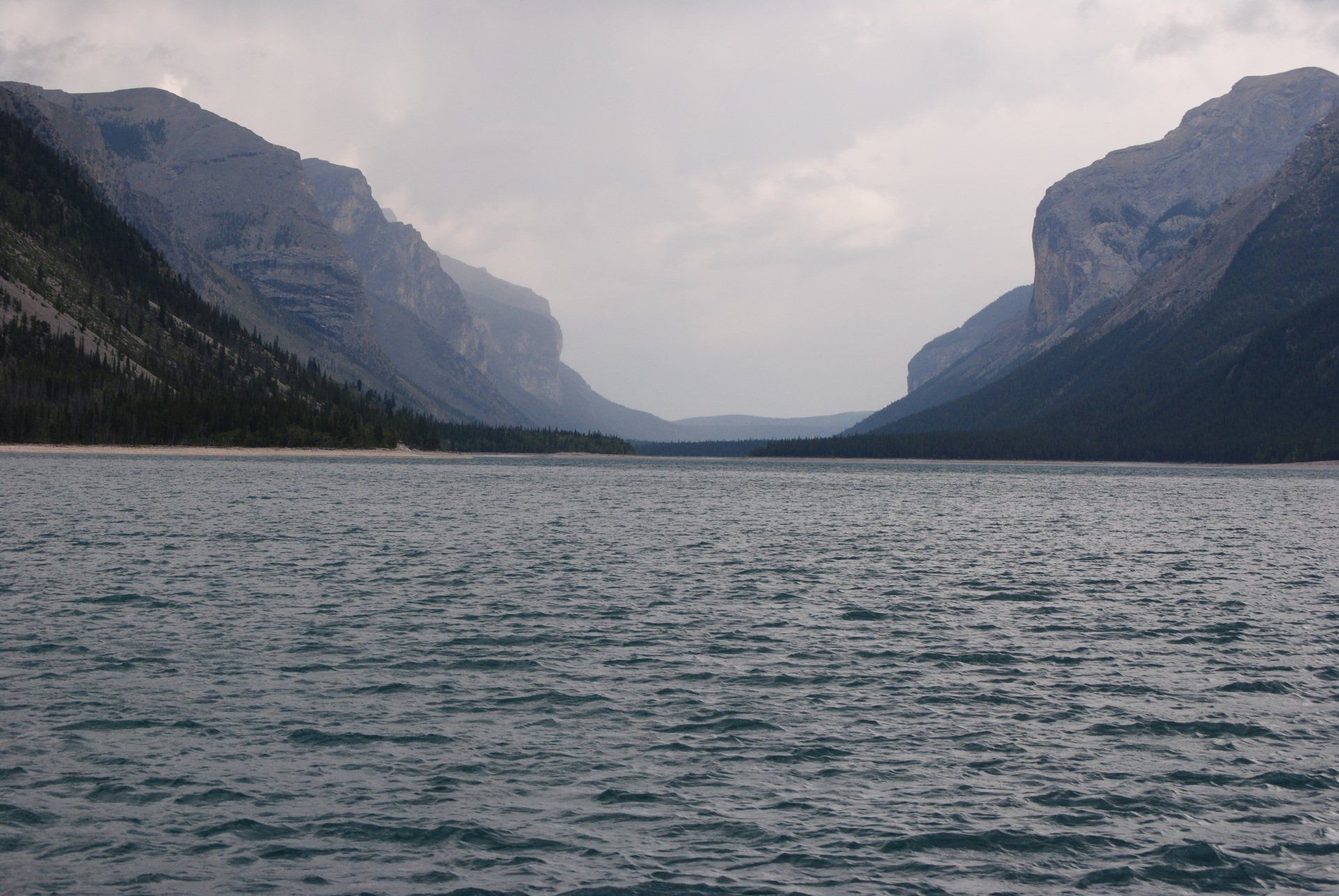 A large body of water with mountains in the background