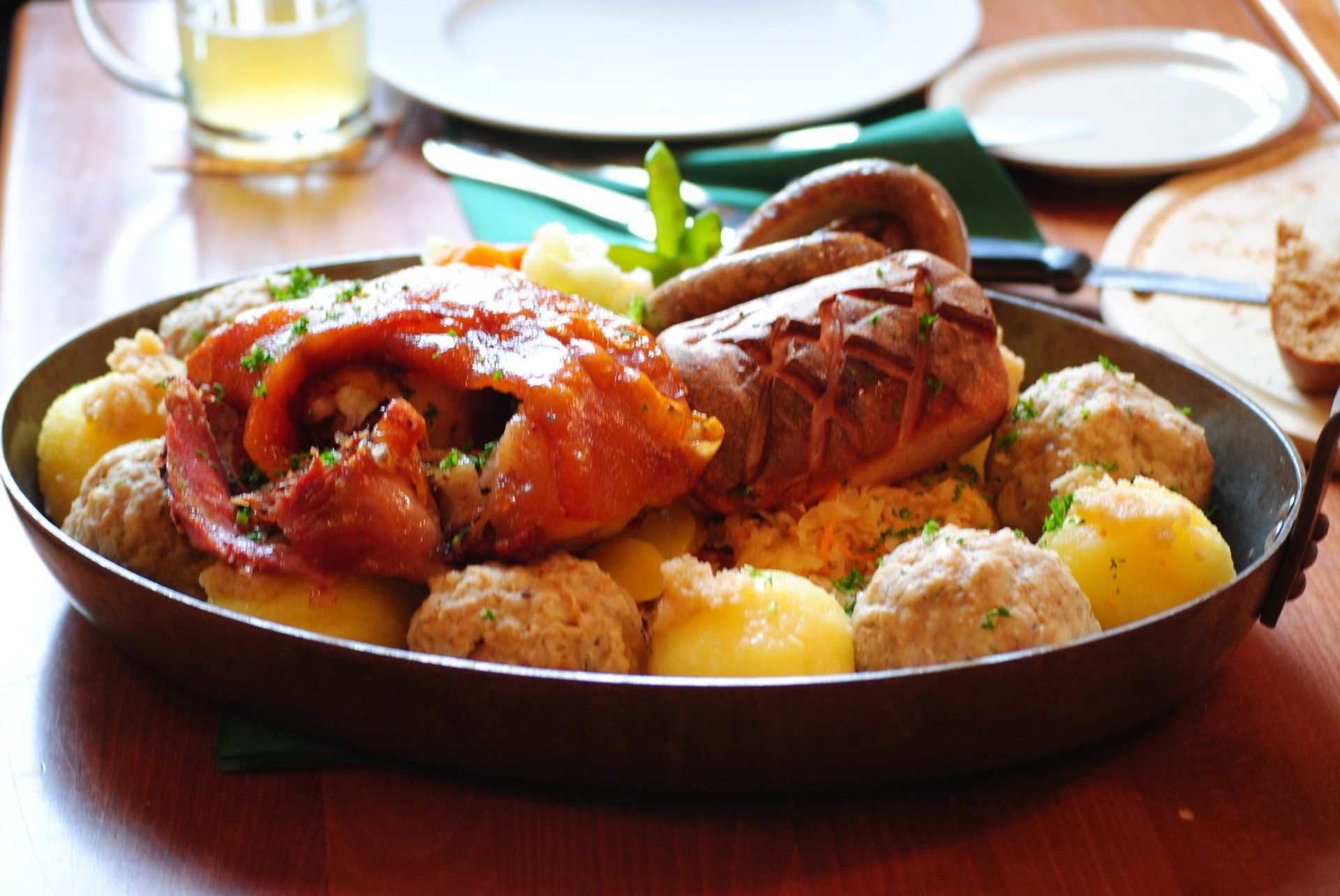 A pan filled with meat and potatoes on a table
