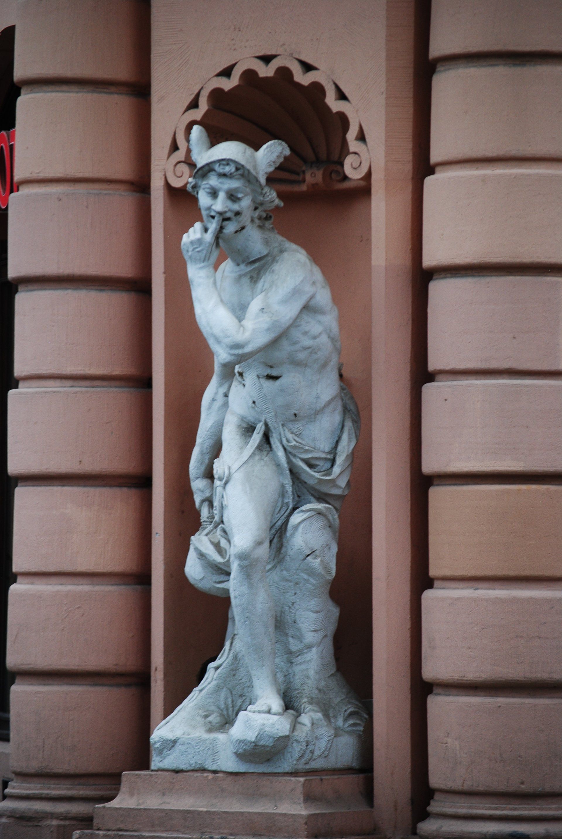 A statue of a man with horns on his head