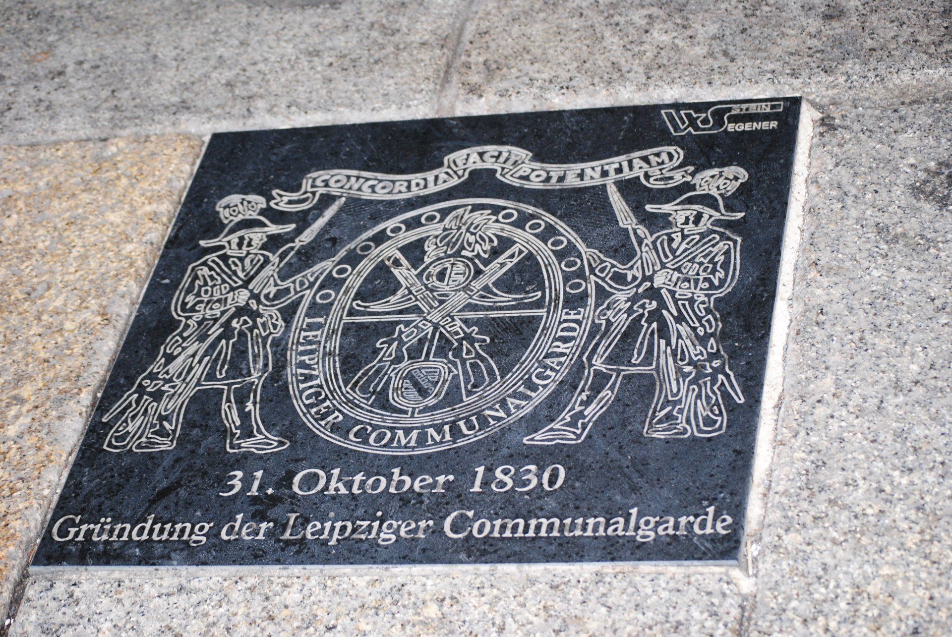 A plaque on a wall that says 31. oktober 1830