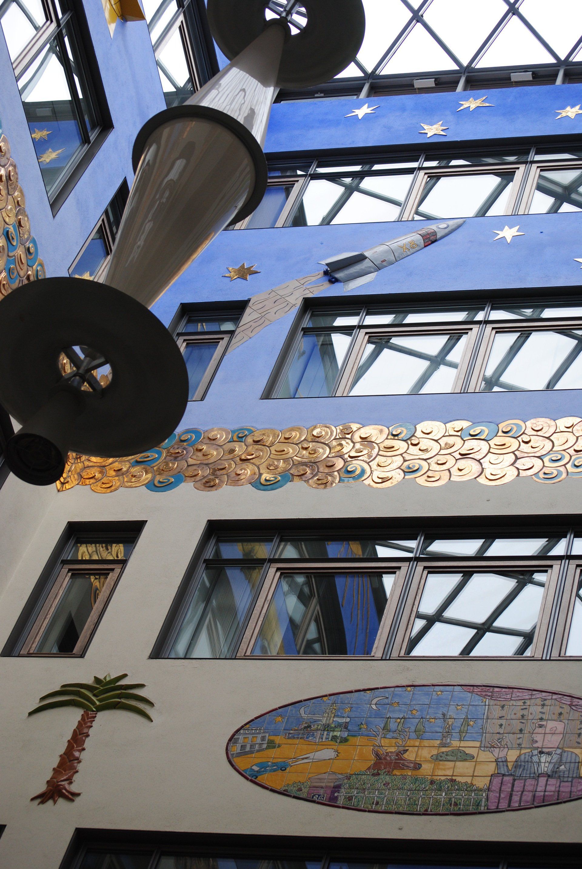 A building with a palm tree on the side of it