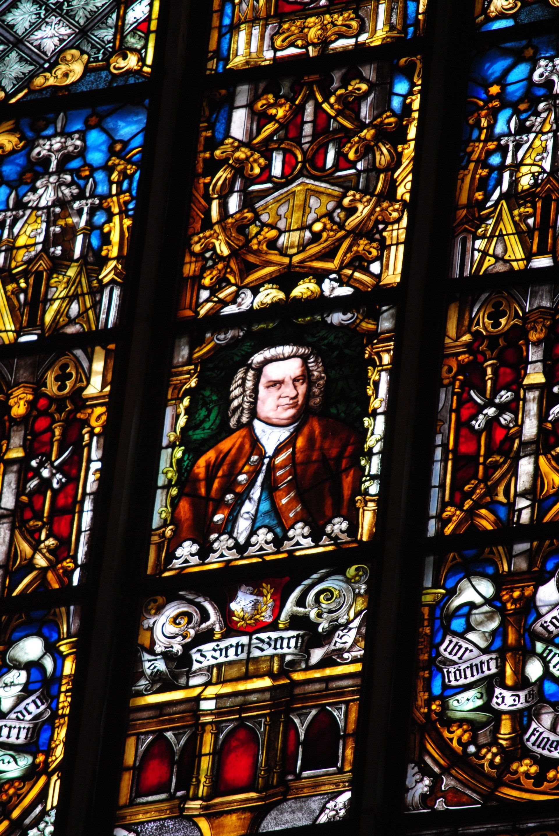A stained glass window with a picture of a man on it