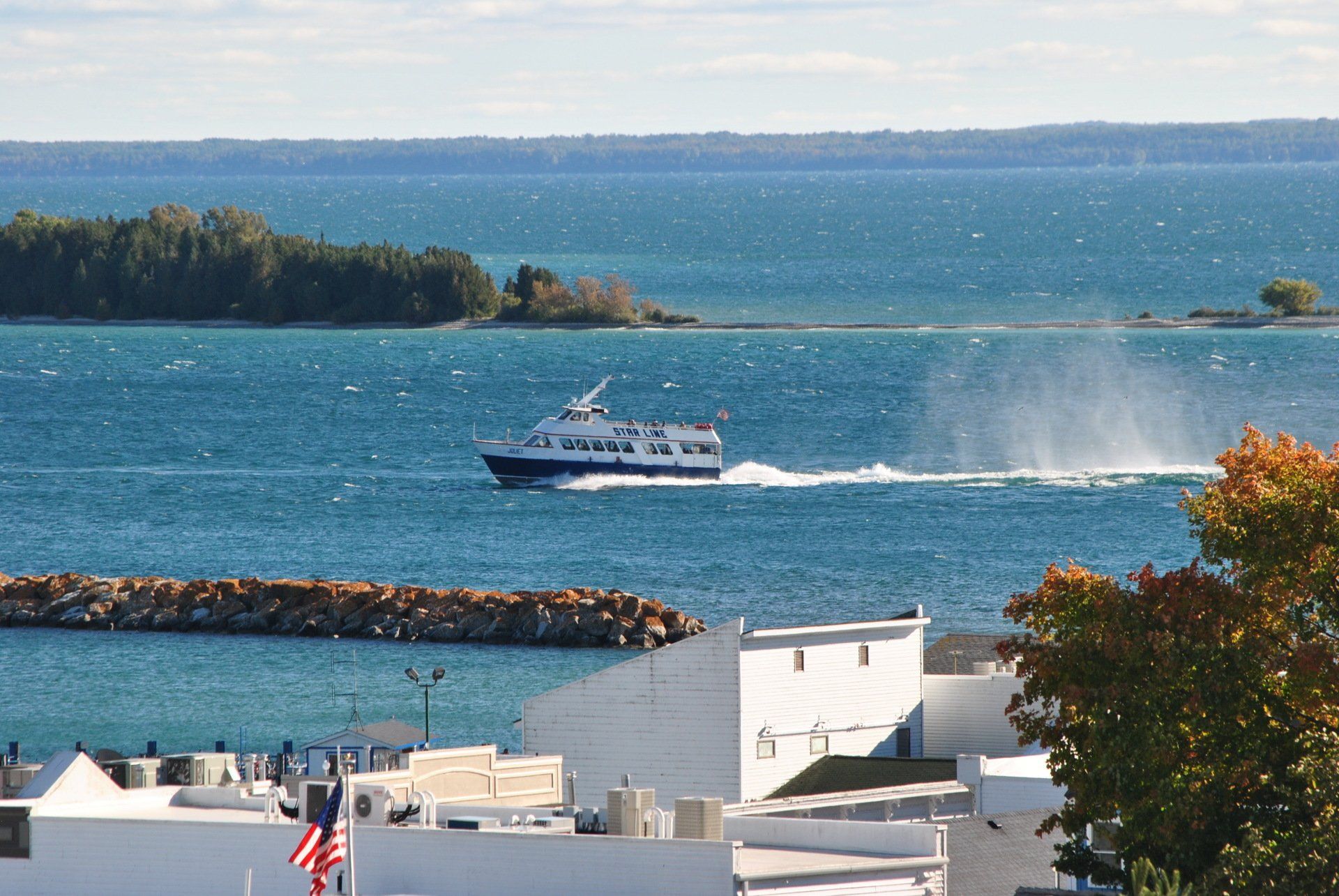 A boat is floating on the water near a dock