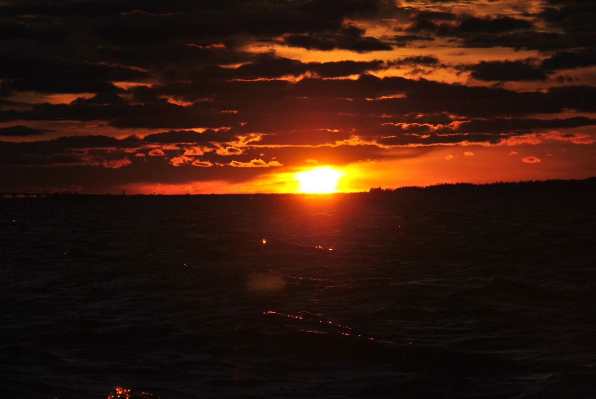 The sun is setting over a body of water