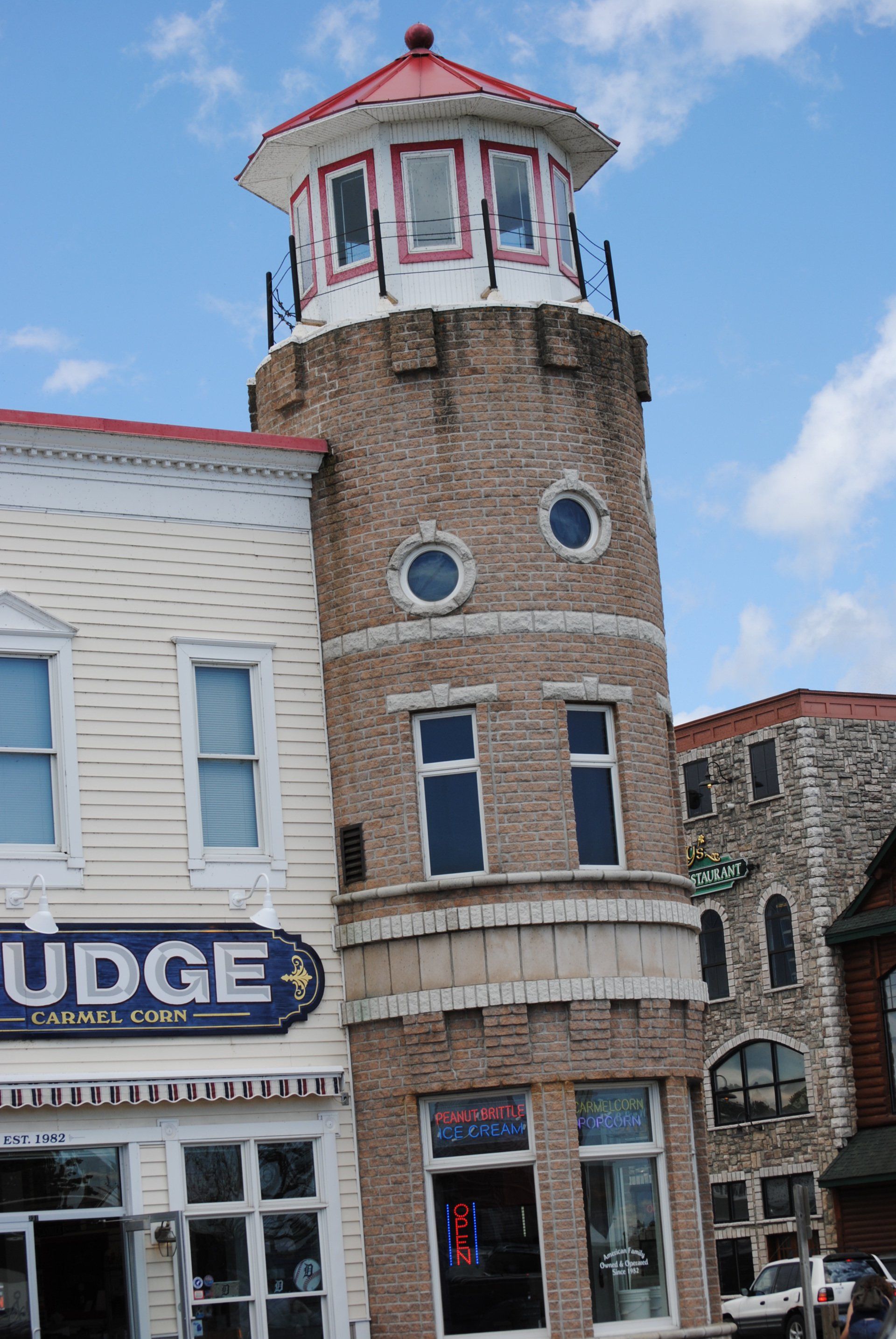 A building with a sign that says ' fudge ' on it
