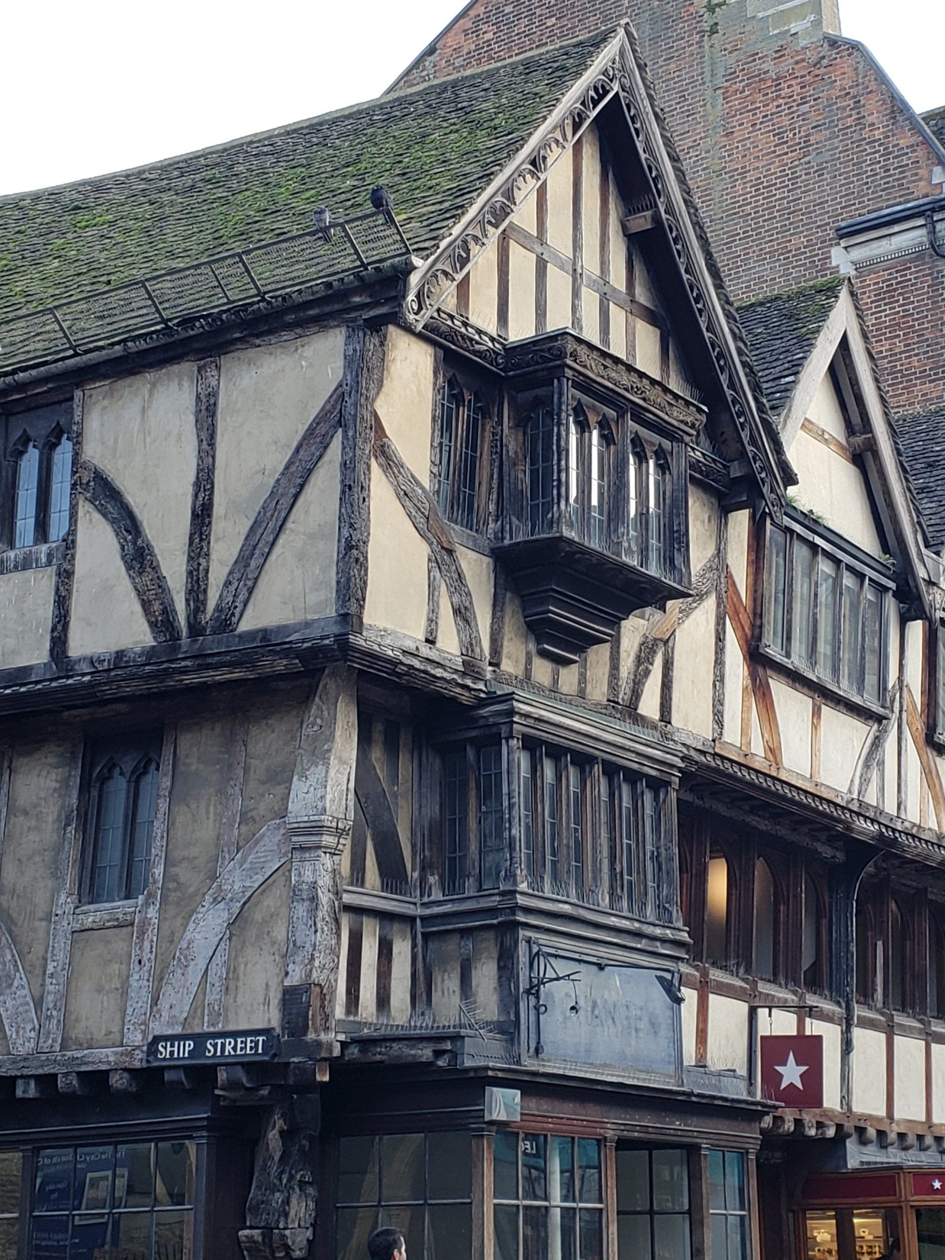 A very old building with a red star on the side of it