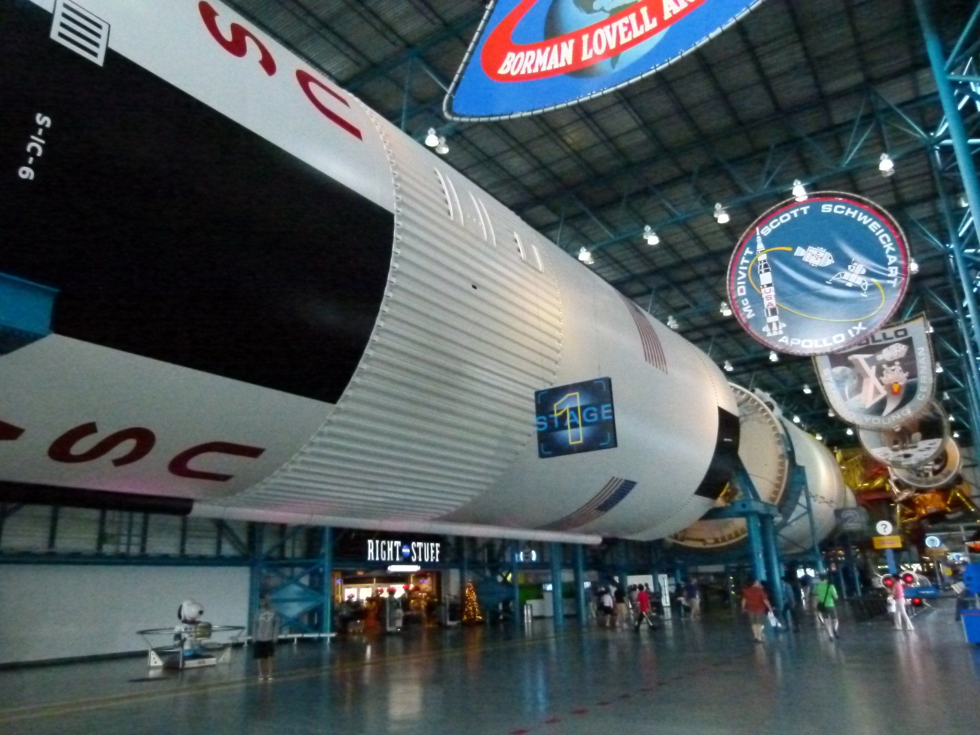 A large space shuttle is displayed in a museum