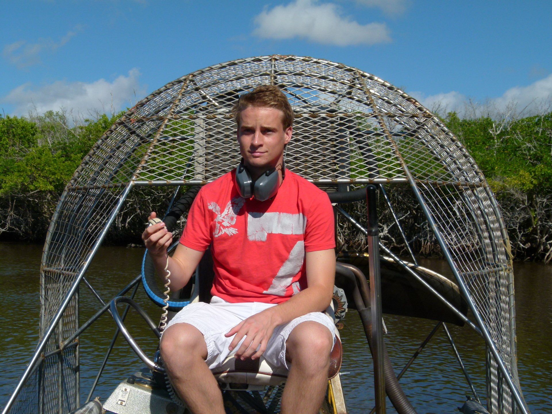 A man in a red shirt with the number 7 on it