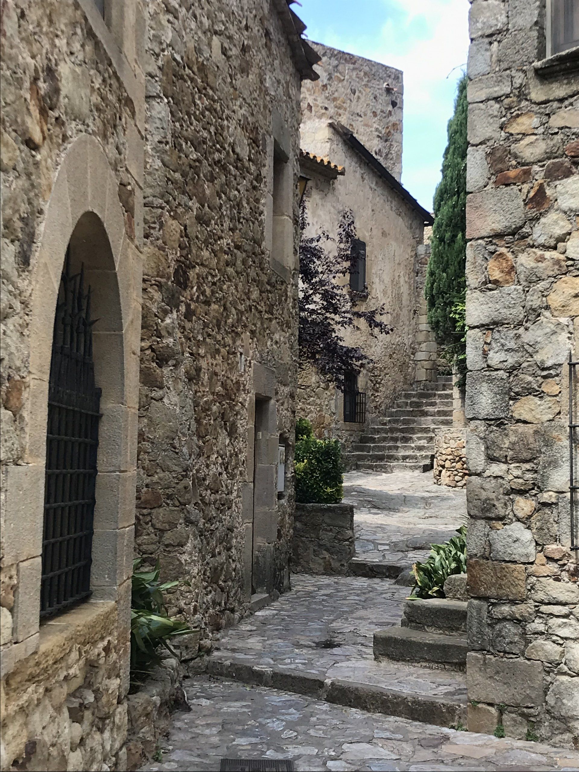 A stone building with stairs leading up to it.