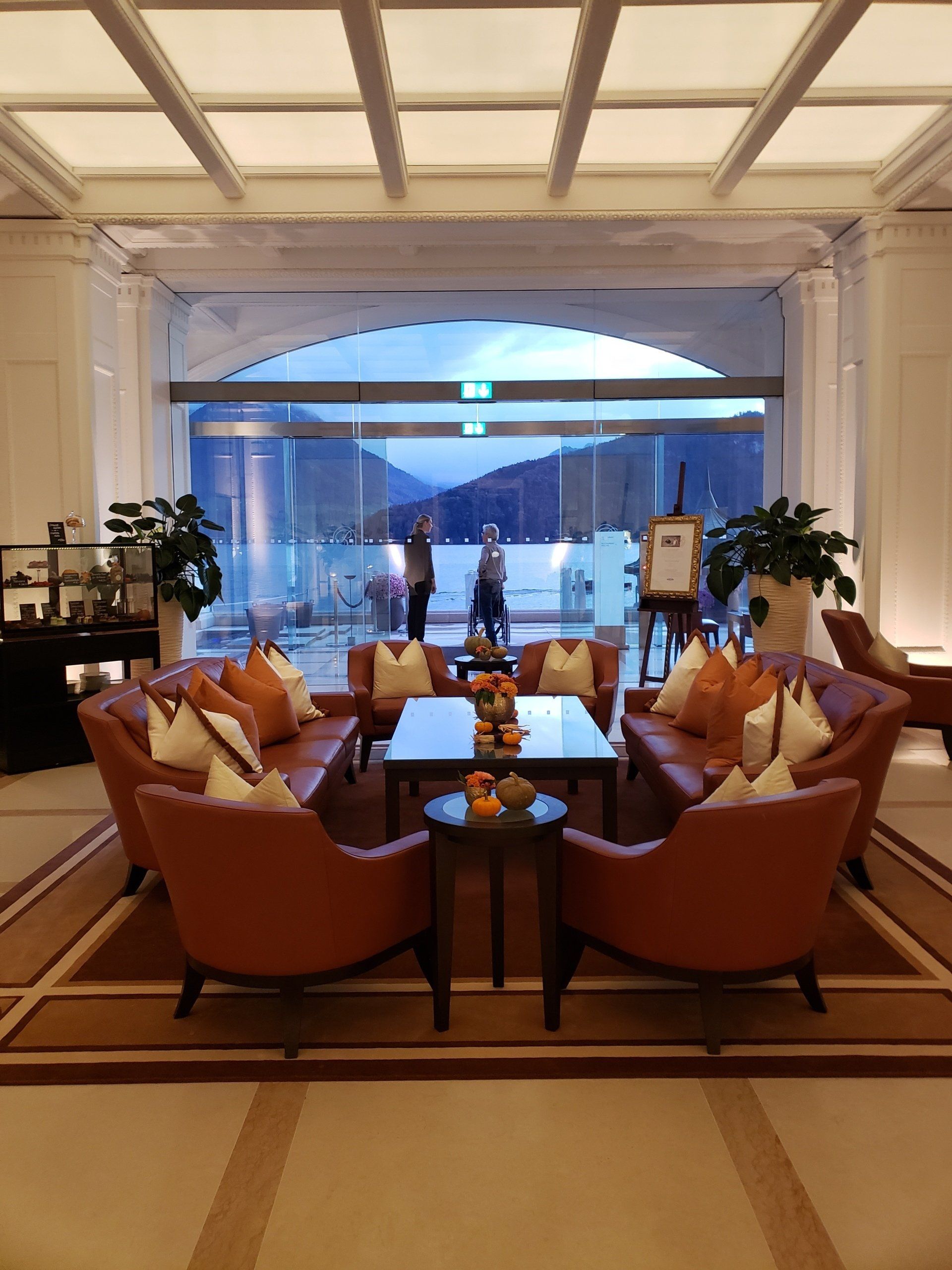 A living room with a lot of furniture and a large window