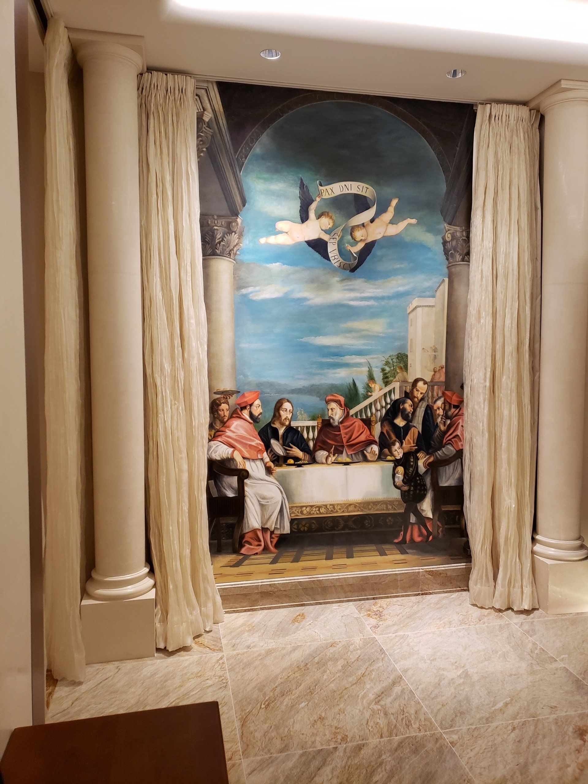 A painting of a group of people sitting around a table