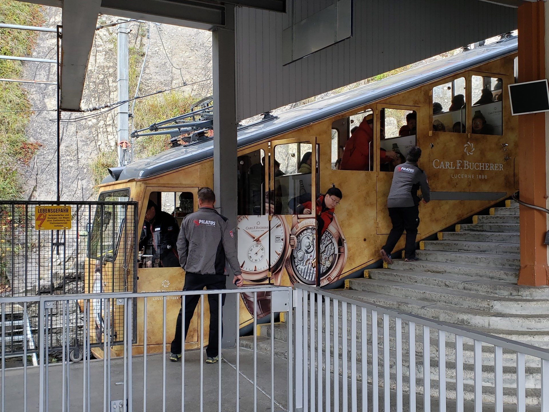 A group of people are standing in front of a building.