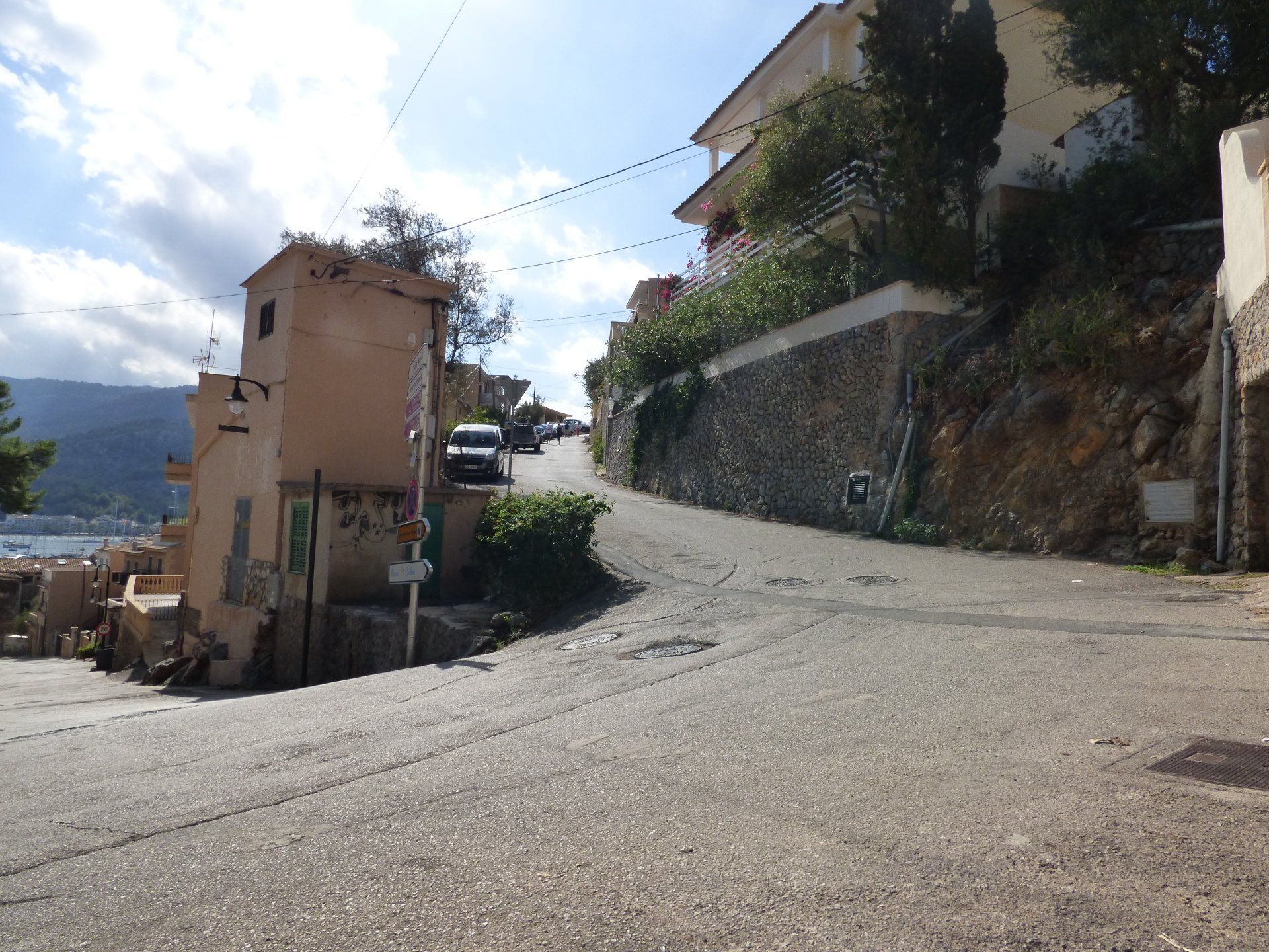 A road with a few buildings on the side of it