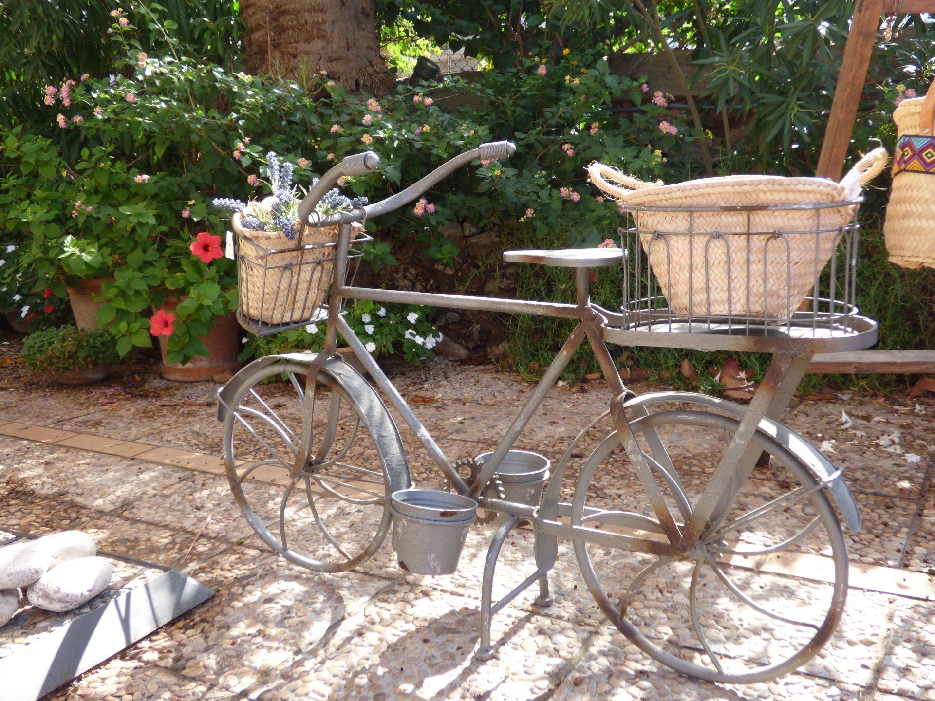 A bicycle with two baskets on the front of it
