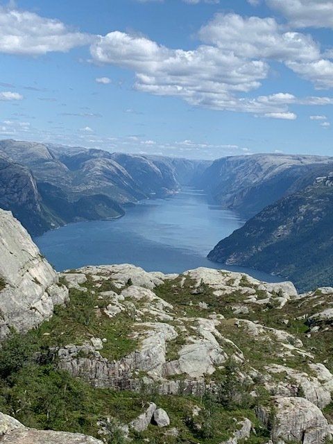 A large body of water surrounded by mountains and rocks
