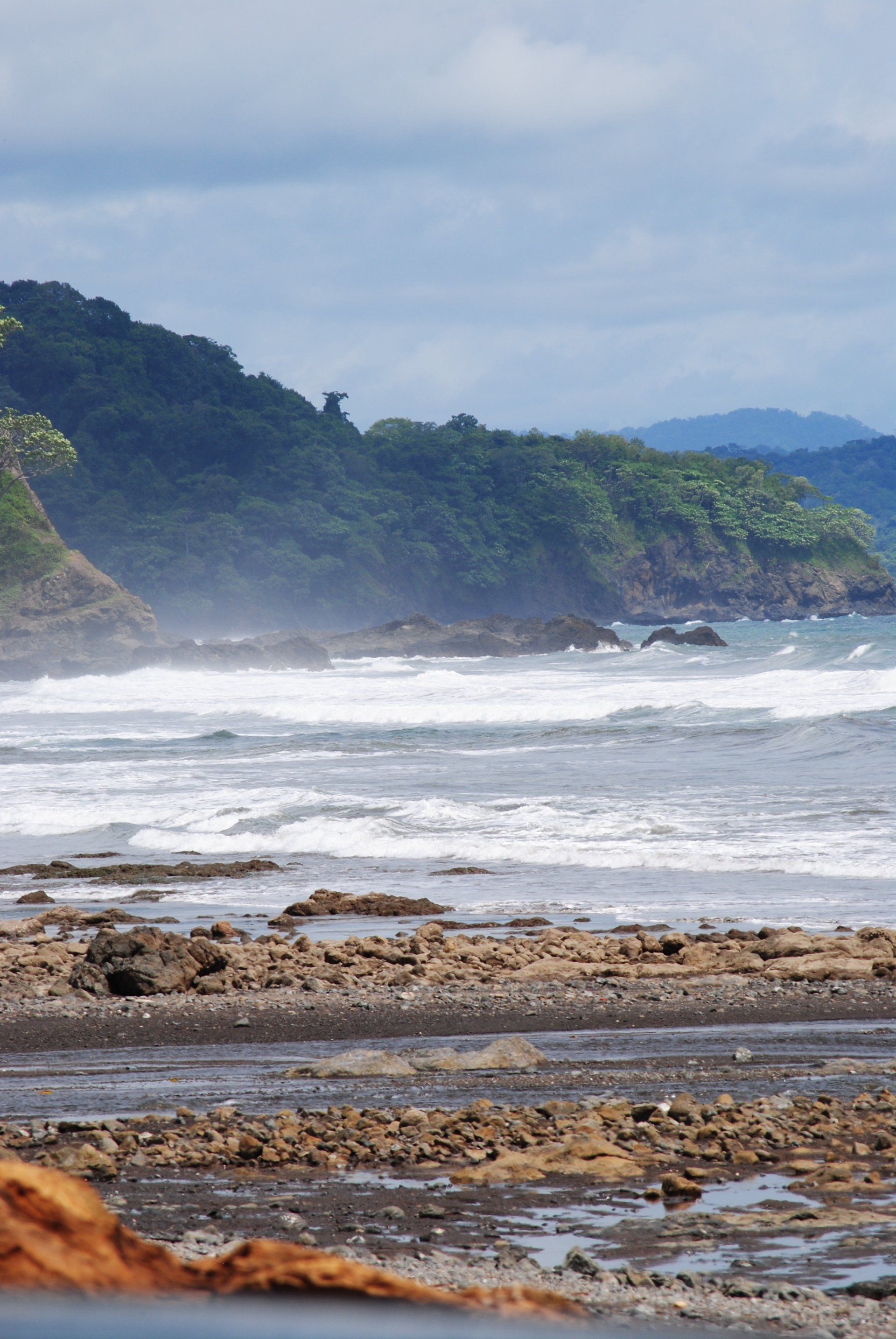 A large body of water with mountains in the background