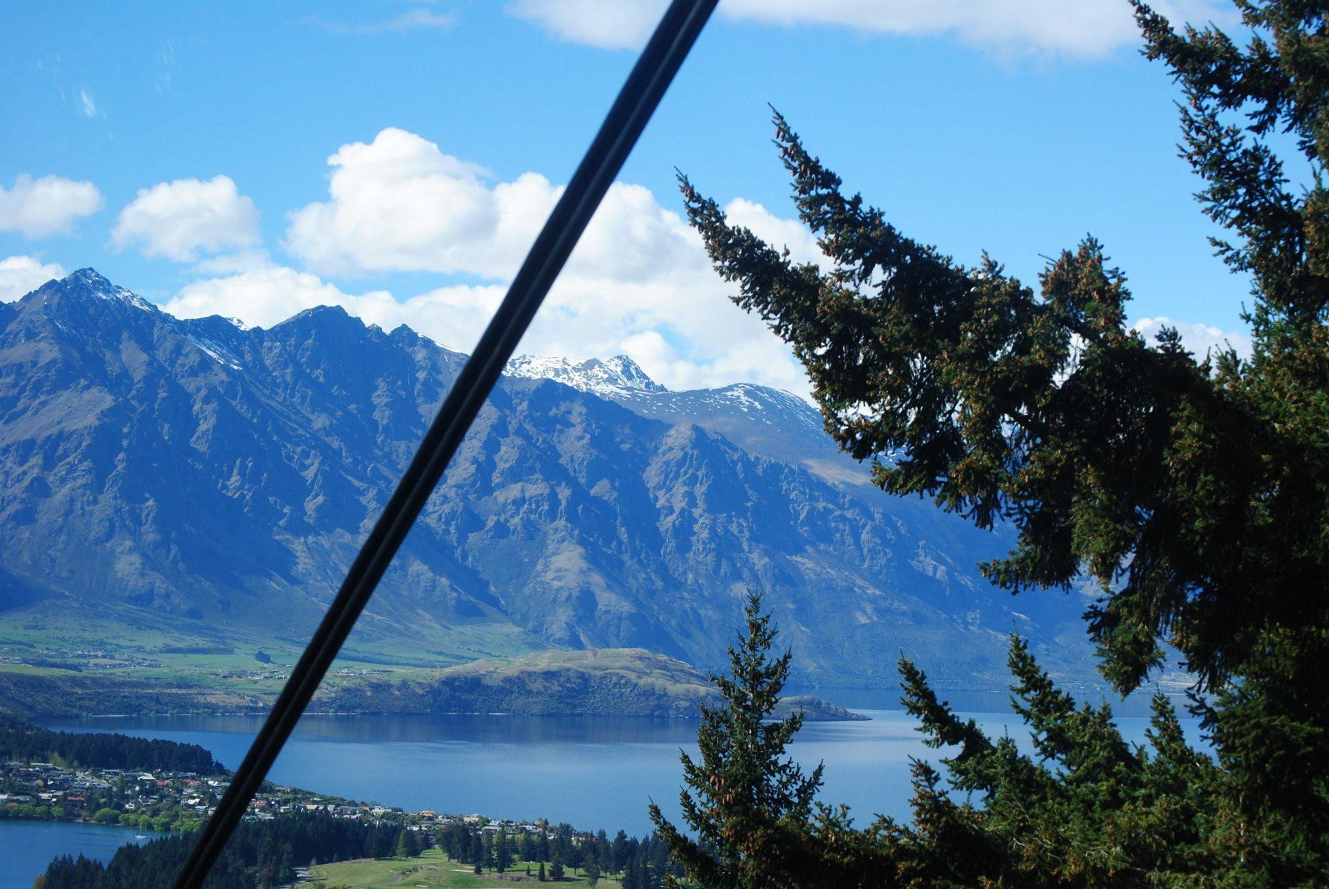 A view of a lake with mountains in the background