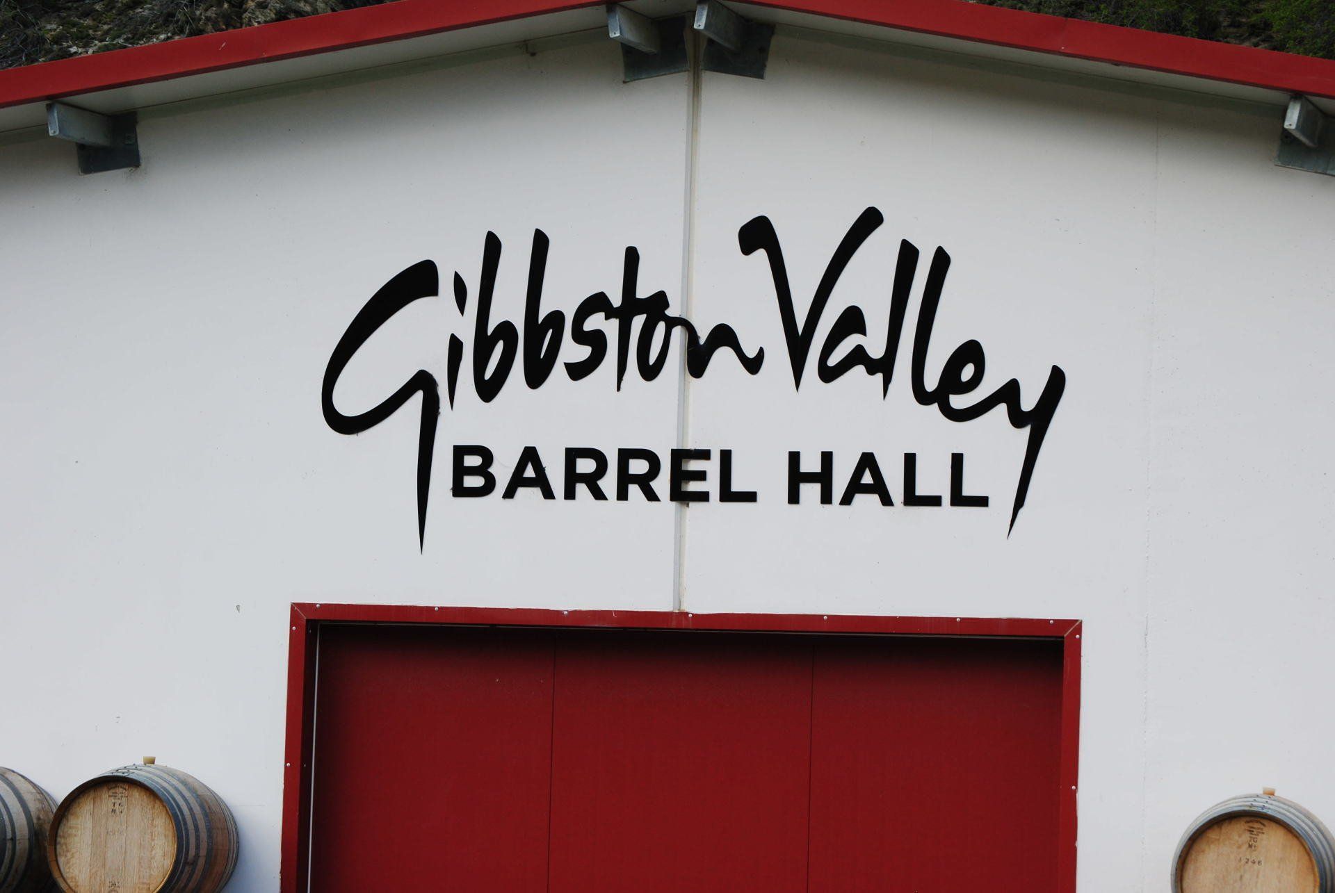 The gibbston valley barrel hall has a red door