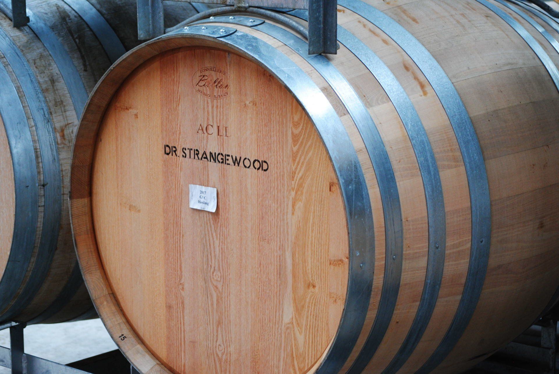 A wooden barrel with the word distillamewood on it