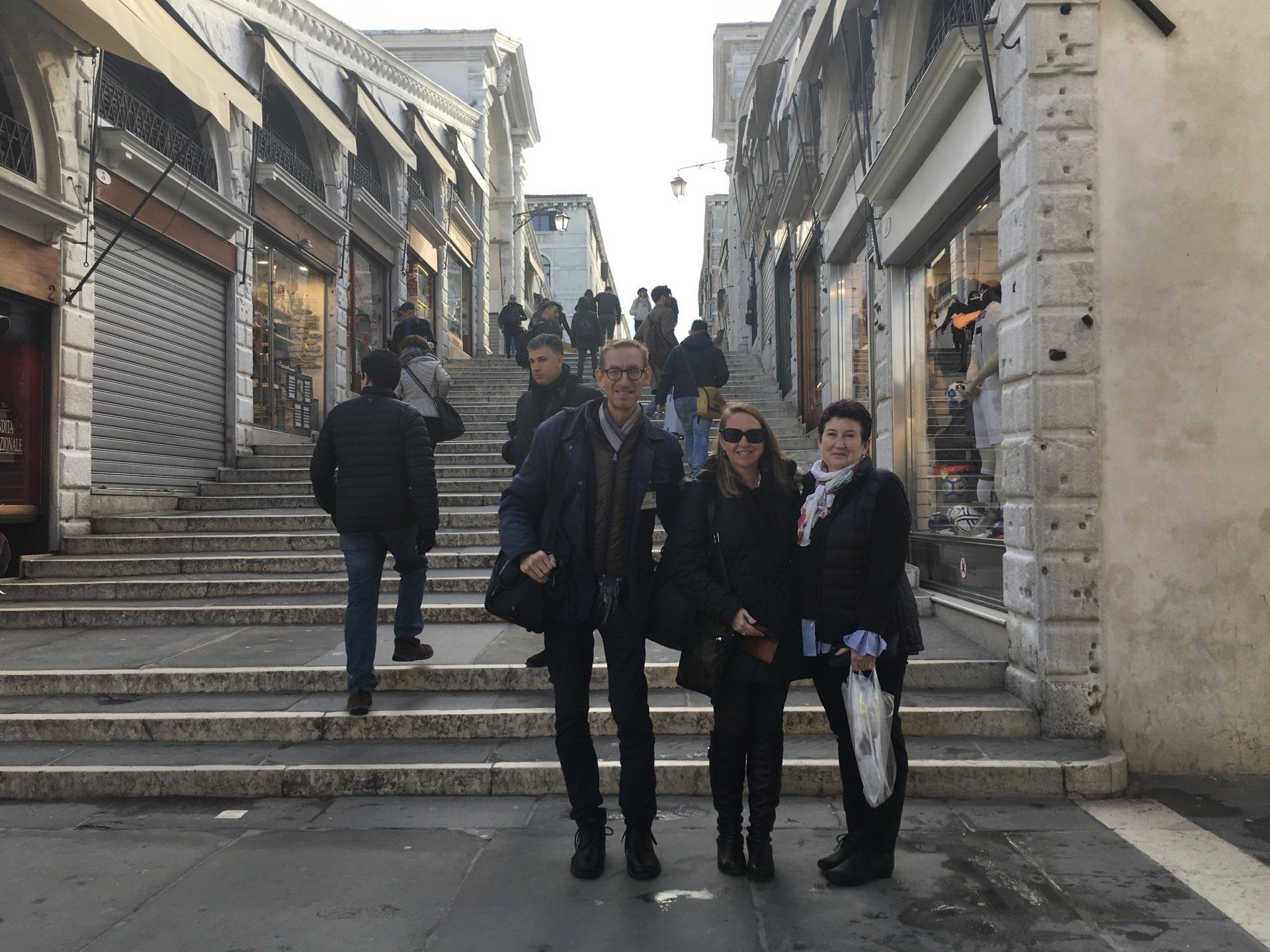 A group of people standing on a set of stairs