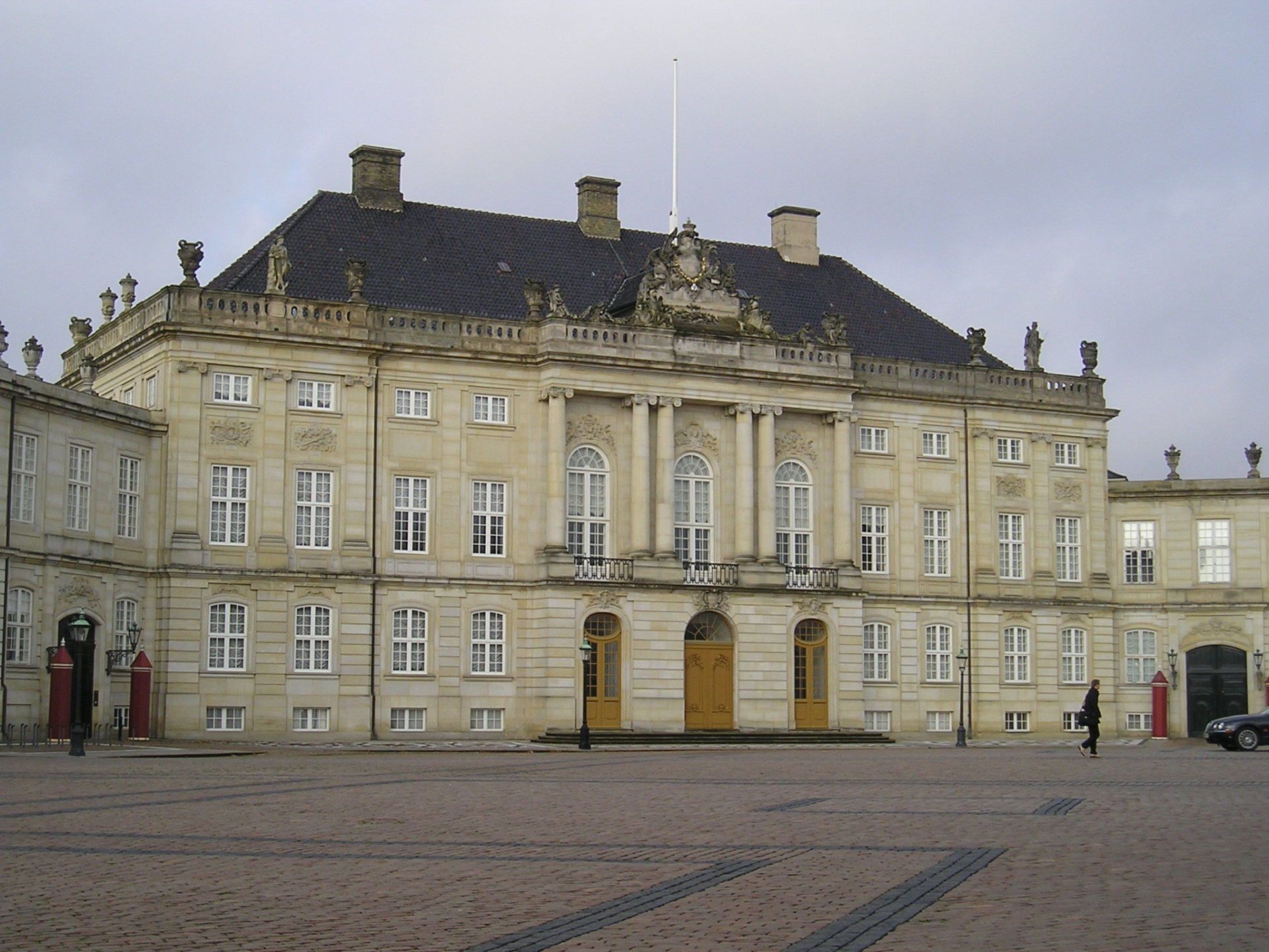 A large building with a flag on top of it