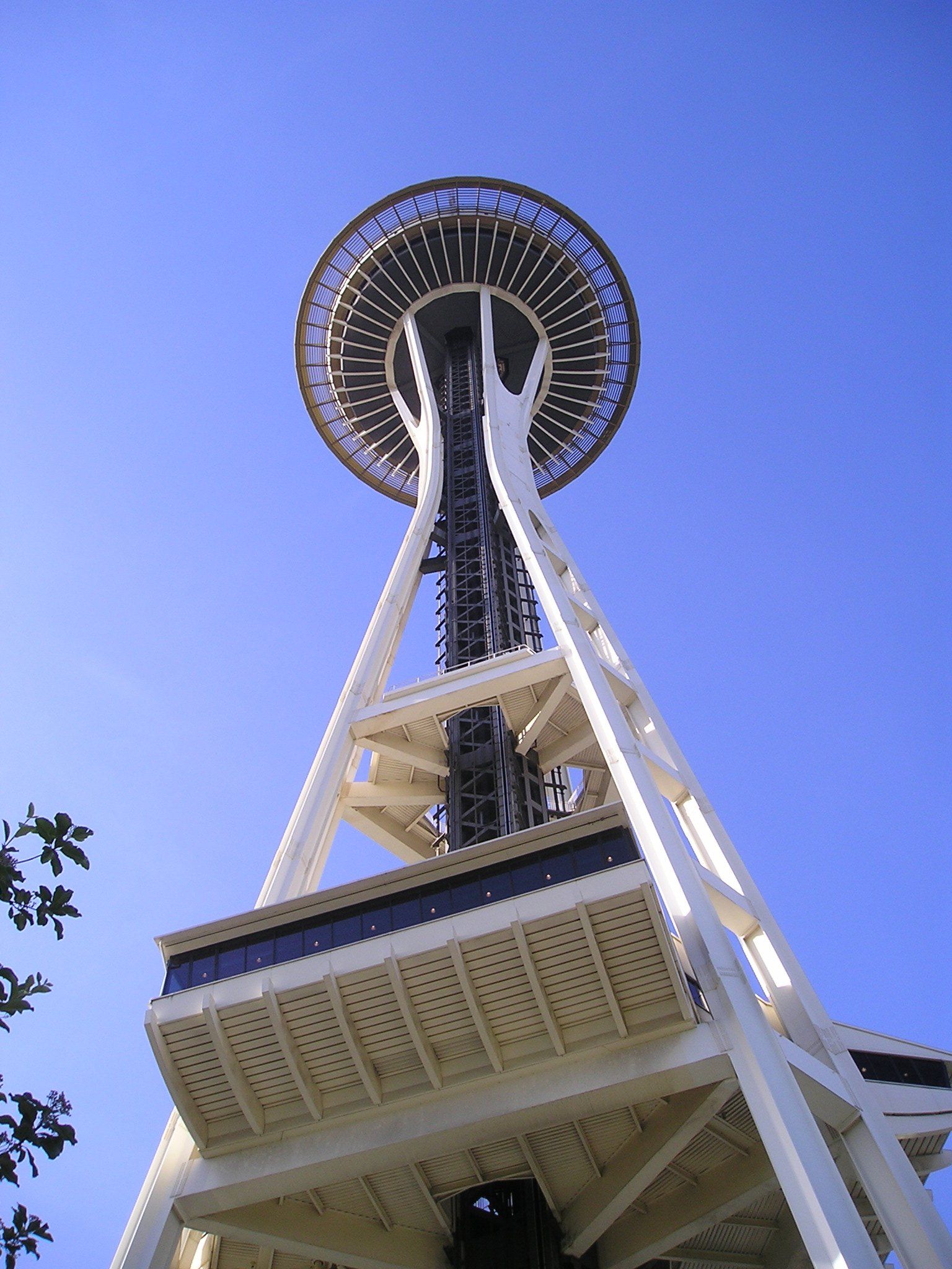 A very tall tower with a blue sky in the background