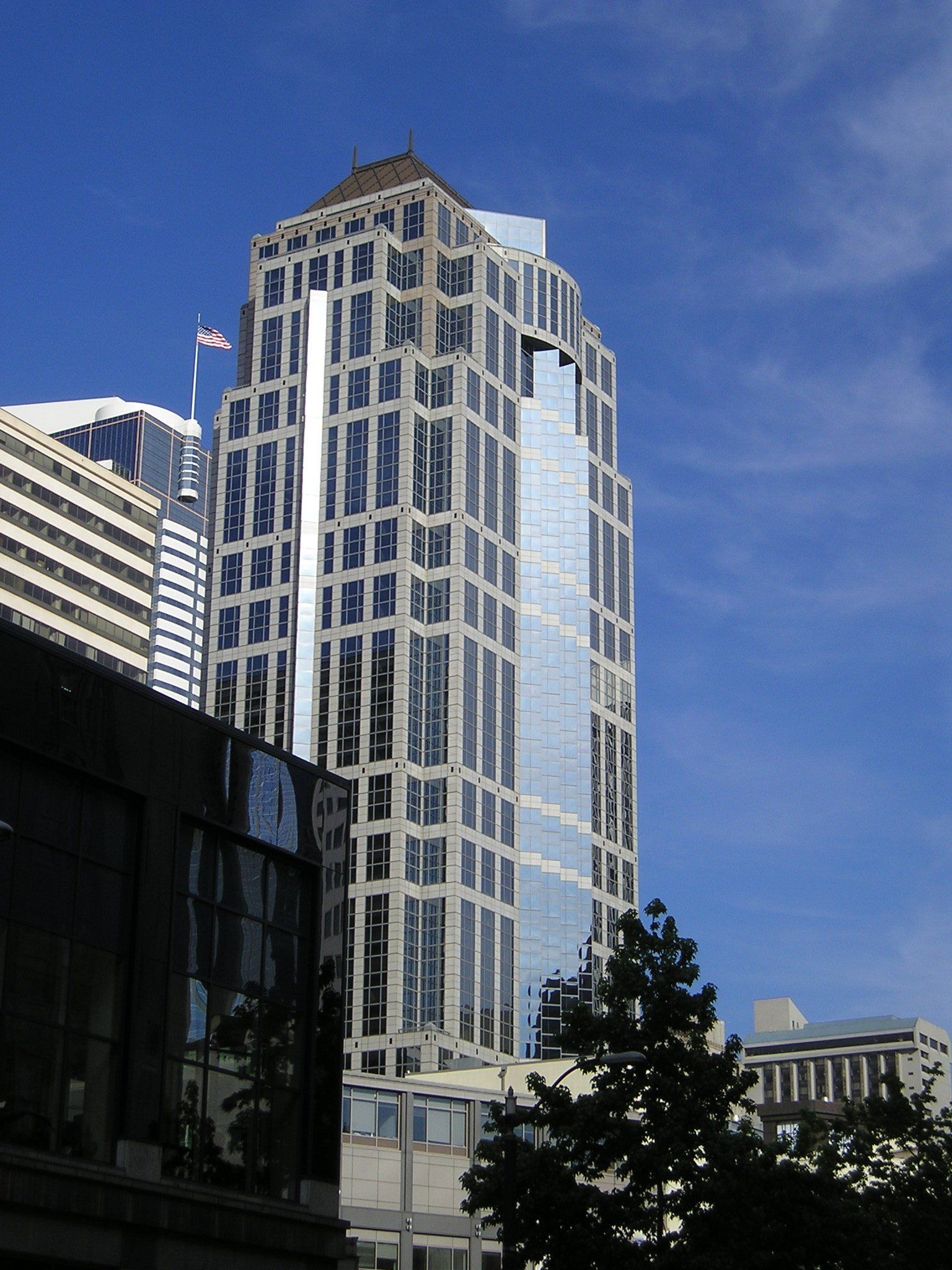 A tall building with a flag on top of it
