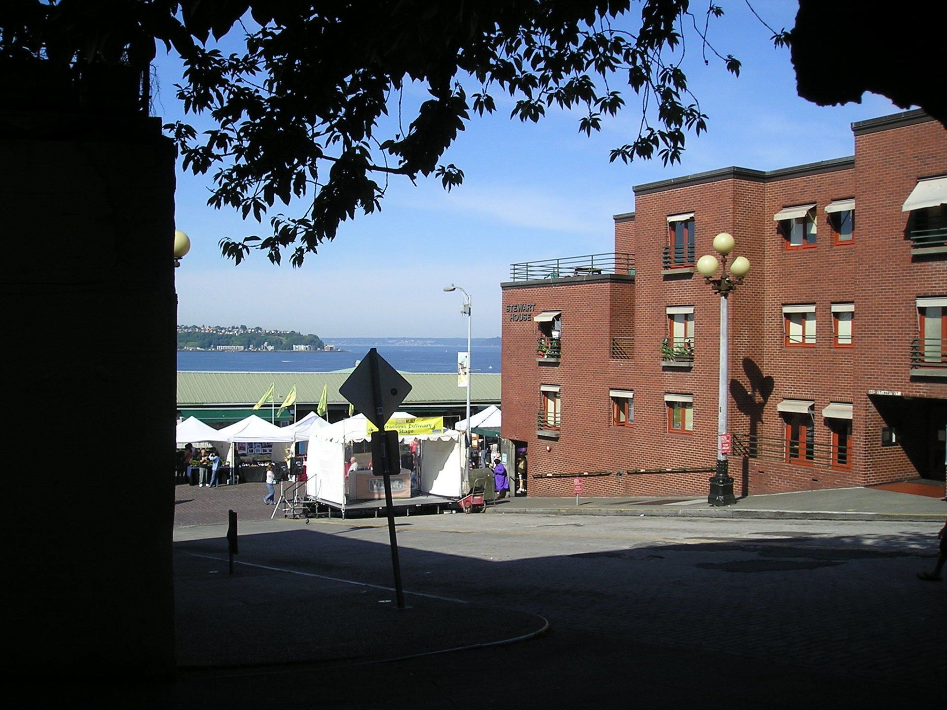 A street scene with a brick building in the background